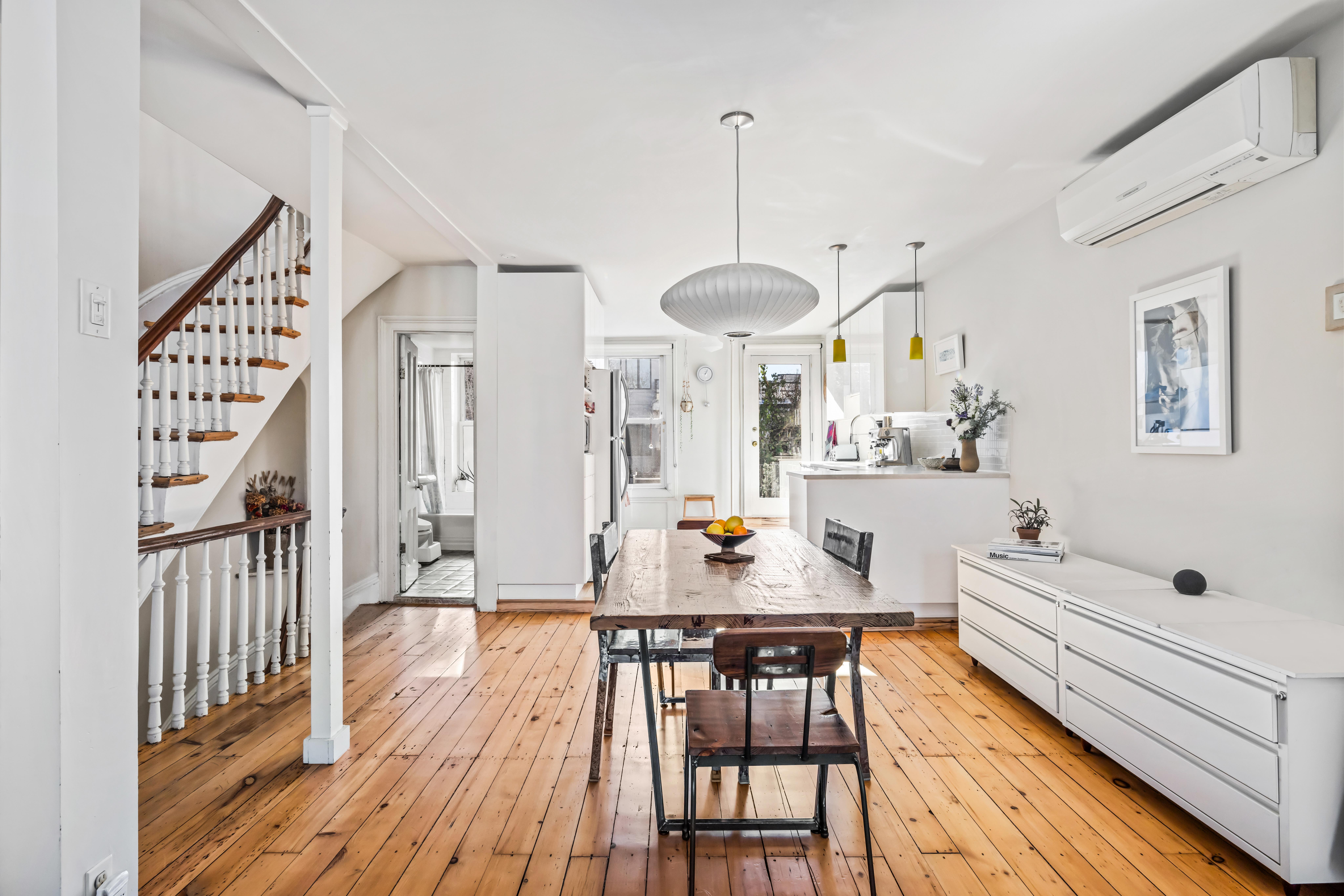 226 11th Street, Unit 2 Brooklyn, NY 11215 - Photo 1 of 19 a view of a dining room and livingroom with furniture wooden floor a chandelier