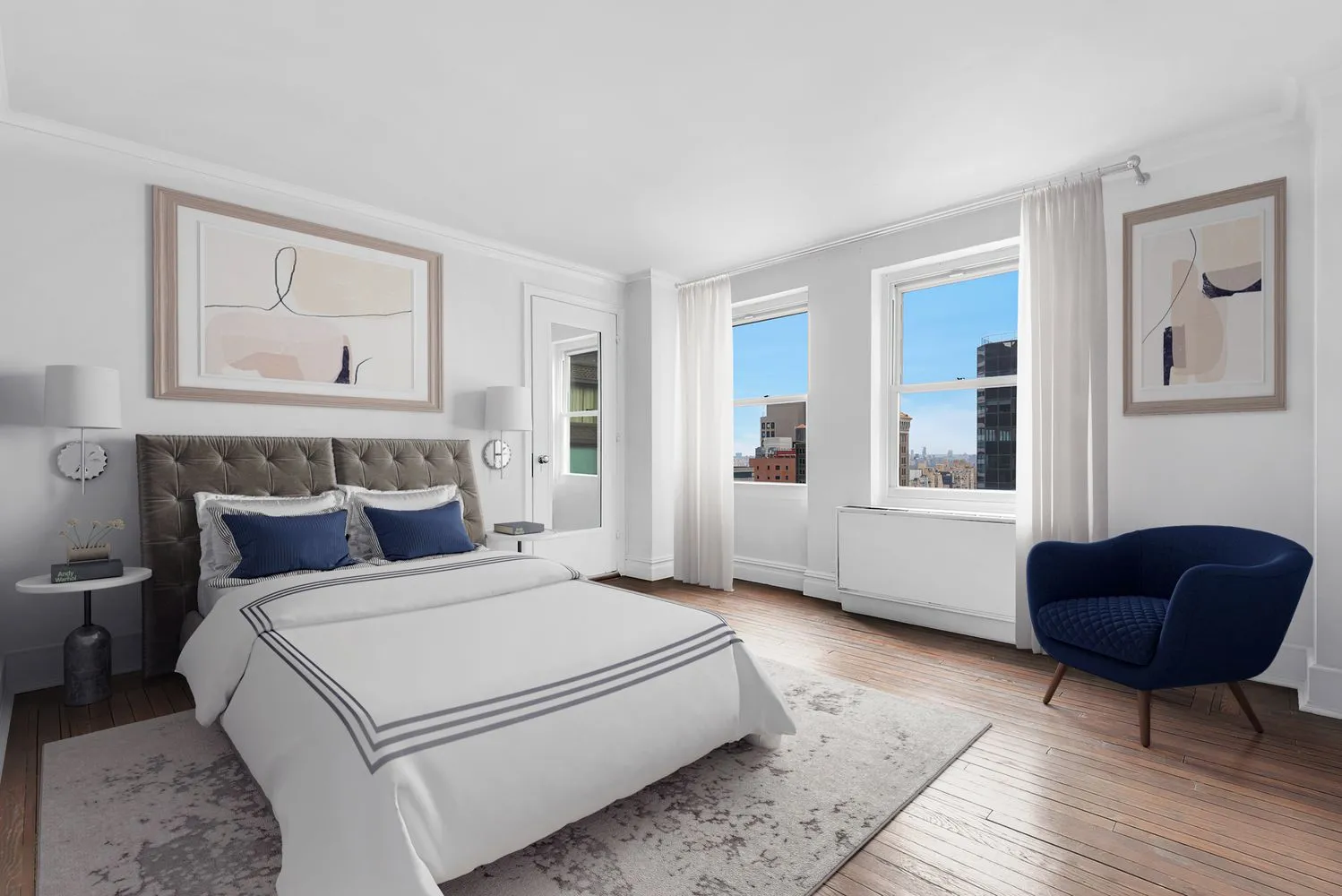 a bedroom with a bed a couch and a window