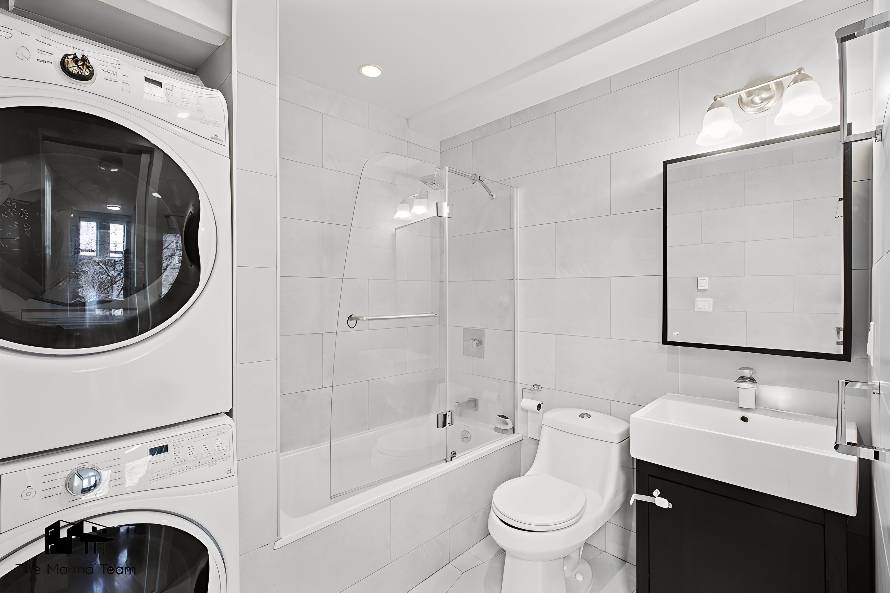 385 Jefferson Avenue, Unit C Brooklyn, NY 11221 - Photo 16 of 21 a bathroom with a toilet a sink and a mirror