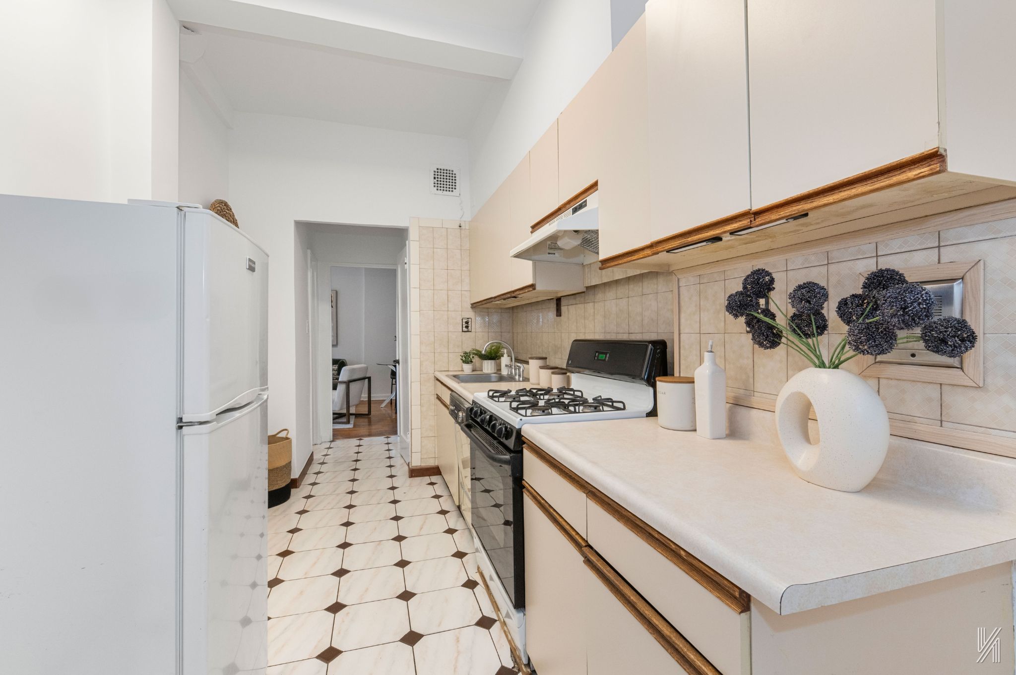 39-30 52nd Street, Unit GA Queens, NY 11377 - Photo 7 of 15 a kitchen with a white stove top oven and sink