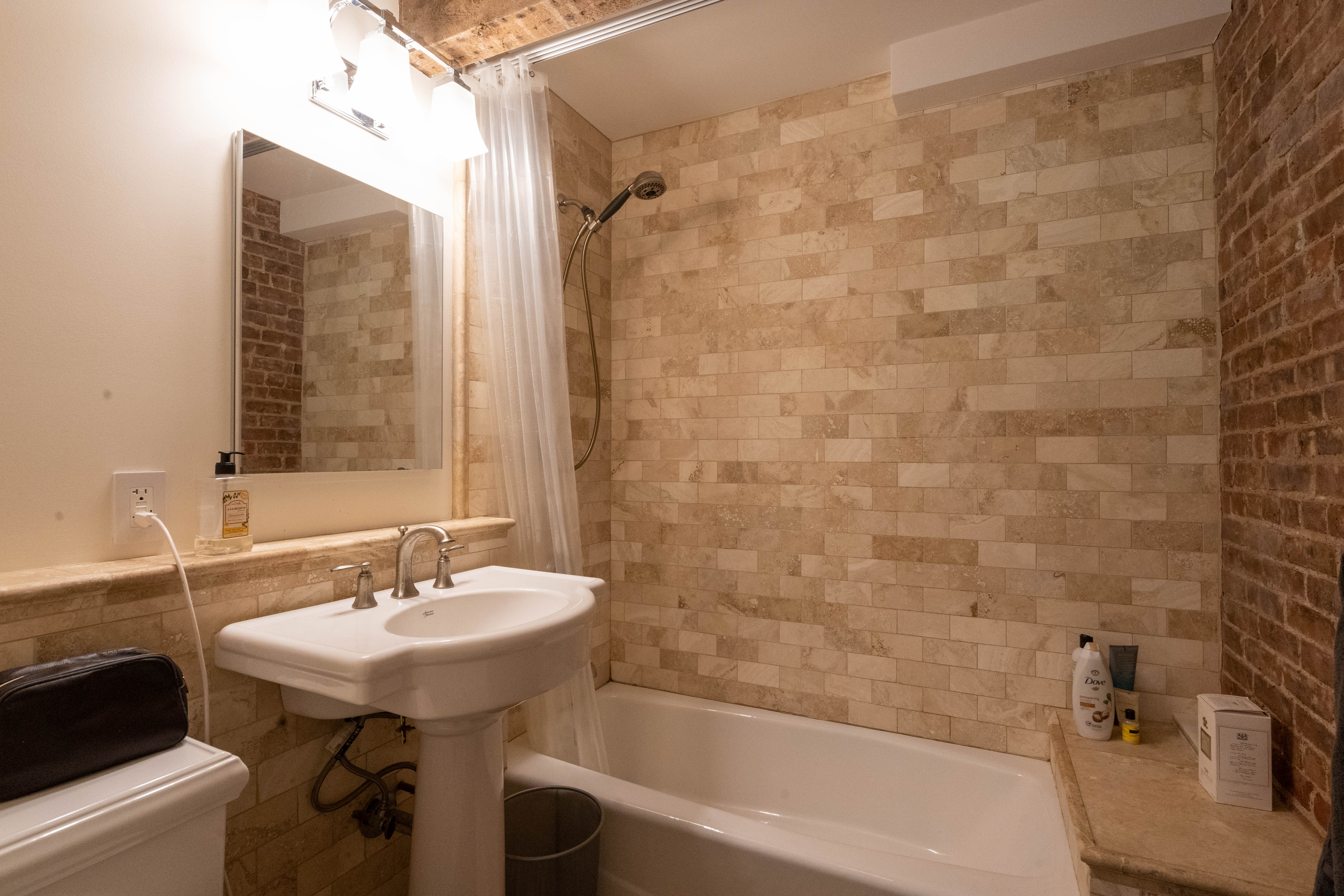 373 Van Brunt Street, Unit 1 Brooklyn, NY 11231 - Photo 4 of 6 a bathroom with a sink and a mirror