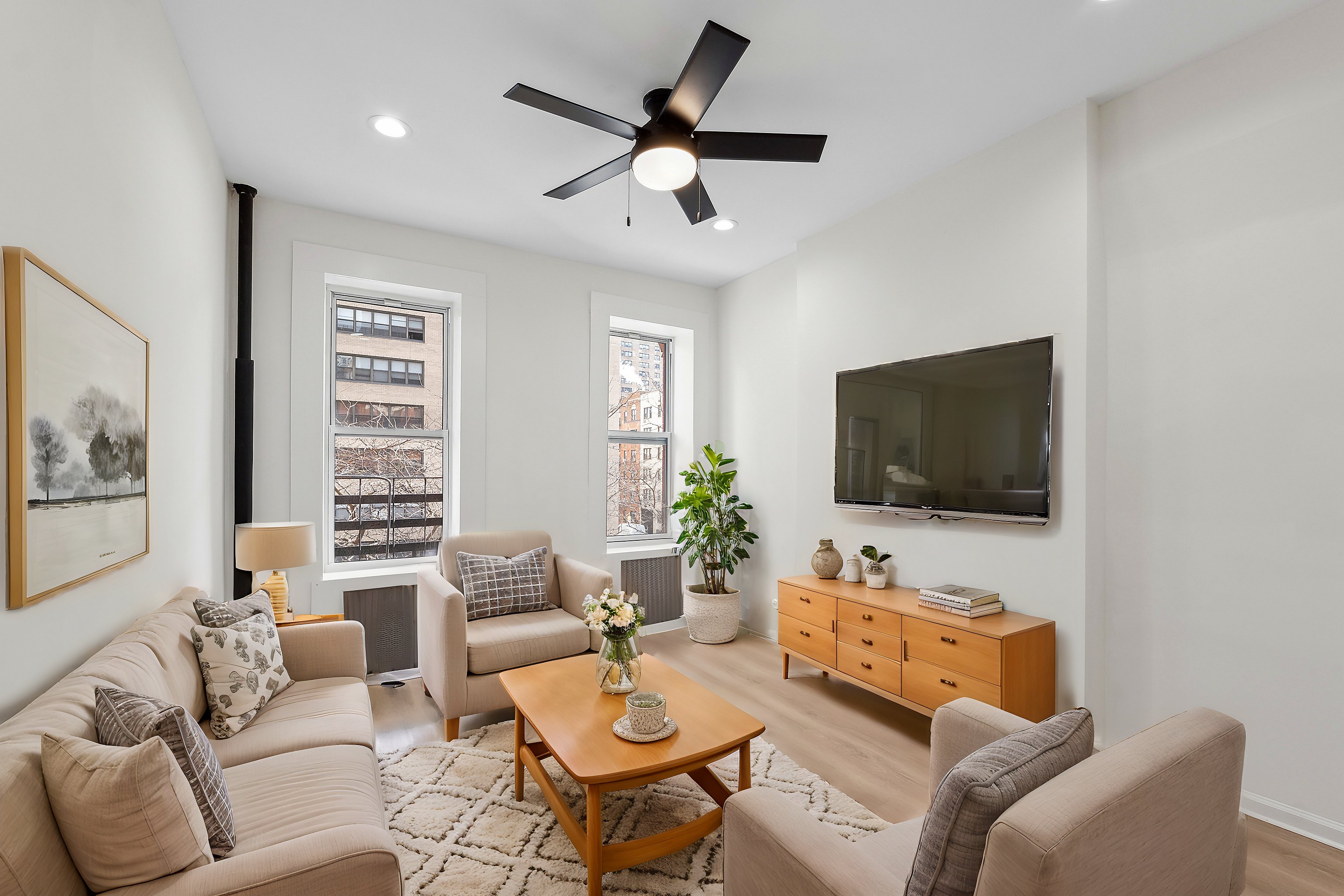 a living room with furniture and a flat screen tv