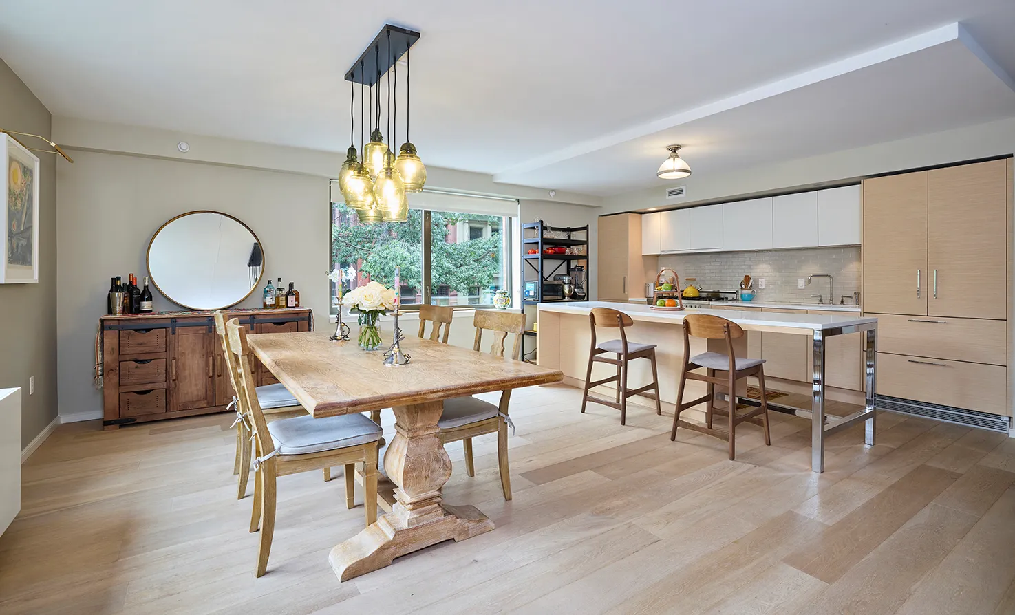 a view of a dining room with furniture window and wooden floor