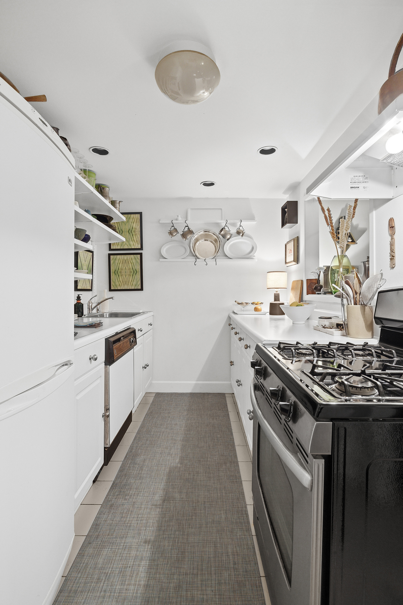 139 St Felix Street, Unit GARDEN Brooklyn, NY 11217 - Photo 2 of 6 a kitchen with stainless steel appliances a stove a sink dishwasher and cabinets