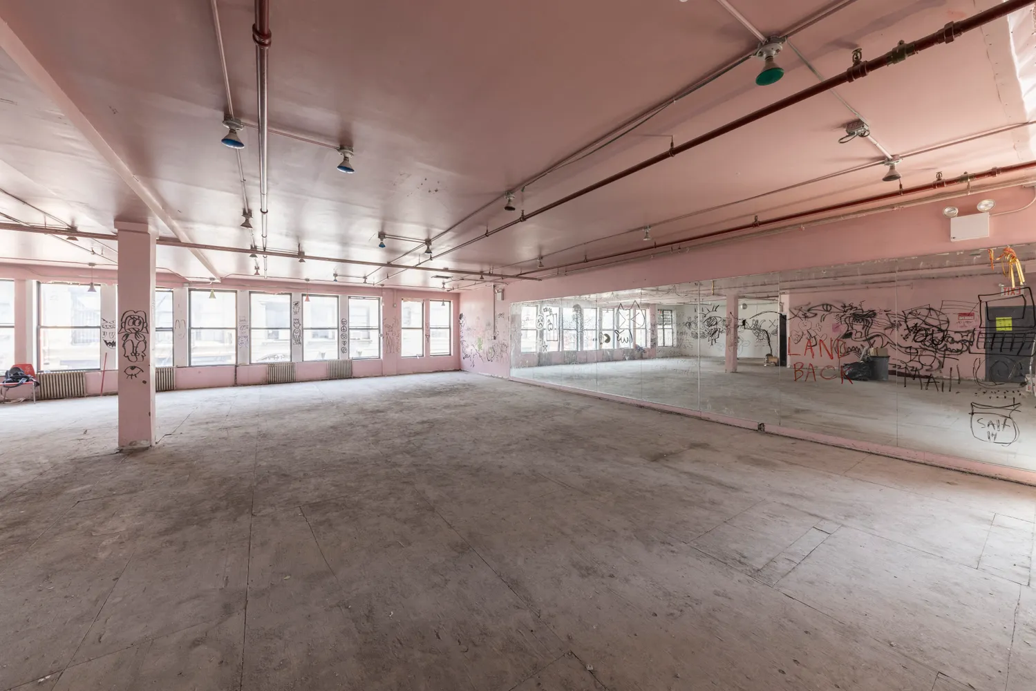 a view of a room with wooden ceiling