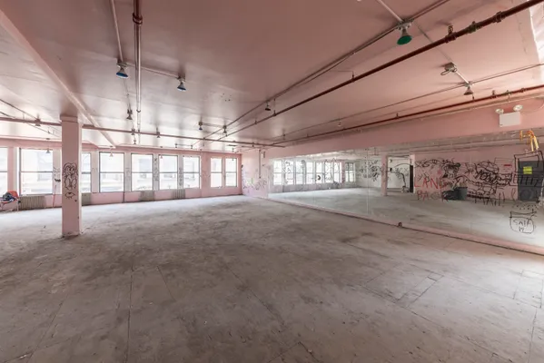 a view of a room with wooden ceiling