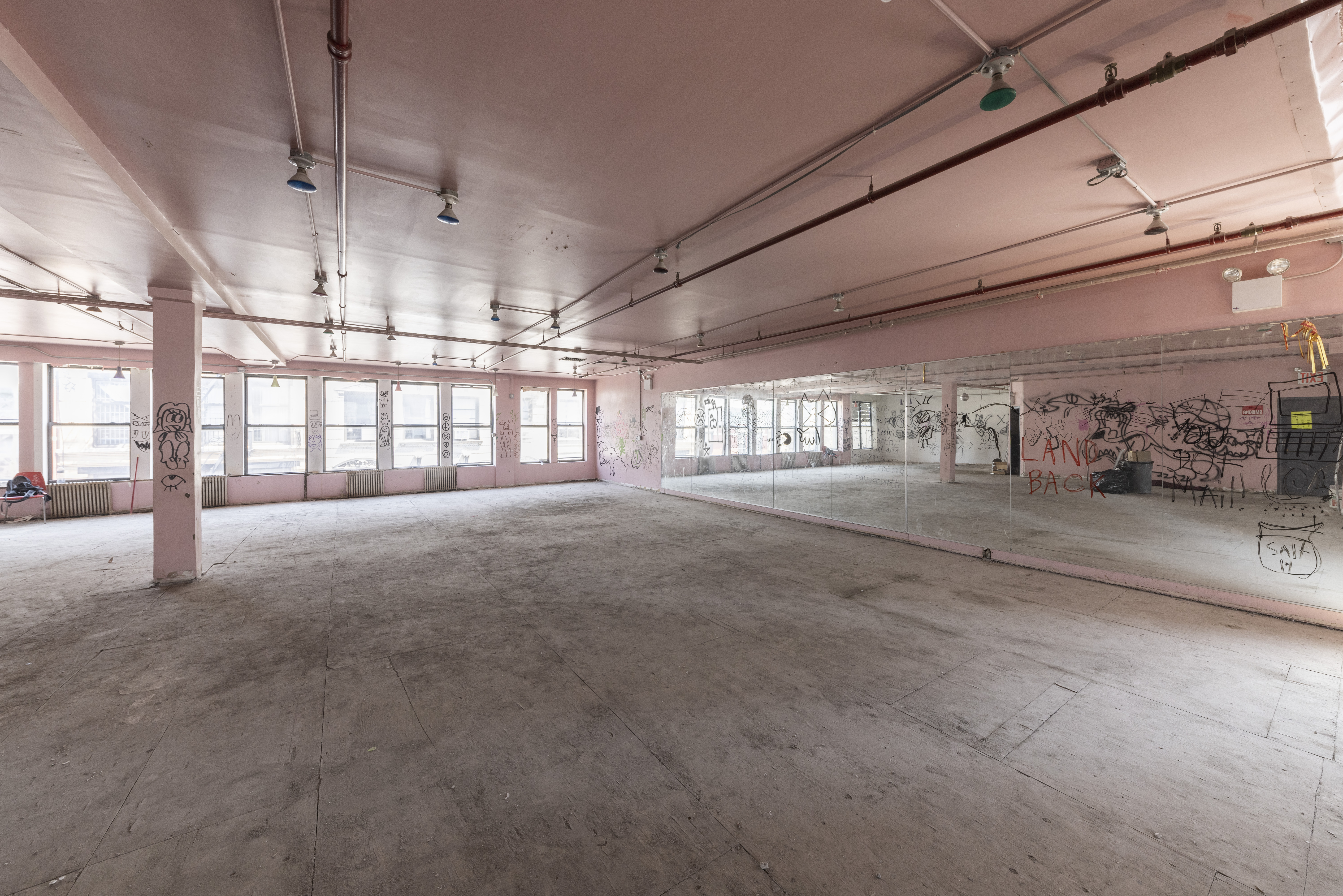 39-41 Eldridge Street Manhattan, NY 10002 - Photo 6 of 16 a view of an empty room with a window