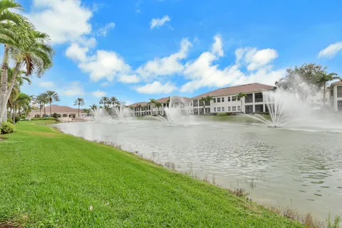 a view of residential houses with outdoor space and lake view
