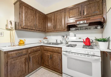 a kitchen with stainless steel appliances granite countertop a sink dishwasher stove and cabinets
