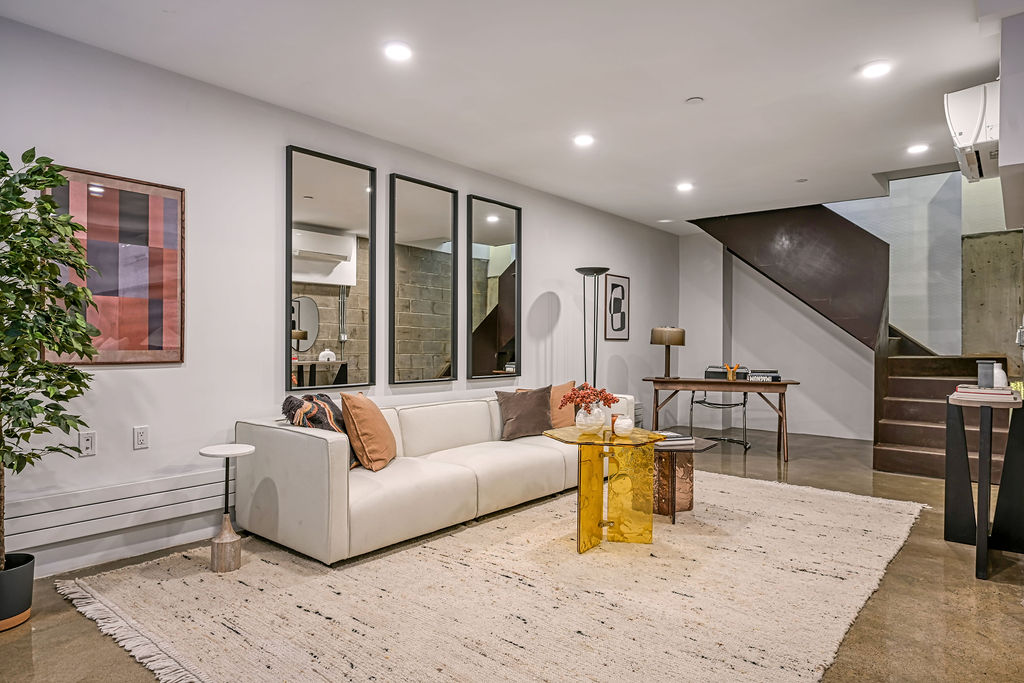 459 Harman Street, Unit 1 Manhattan, NY 10026 - Photo 12 of 17 a living room with furniture and wooden floor