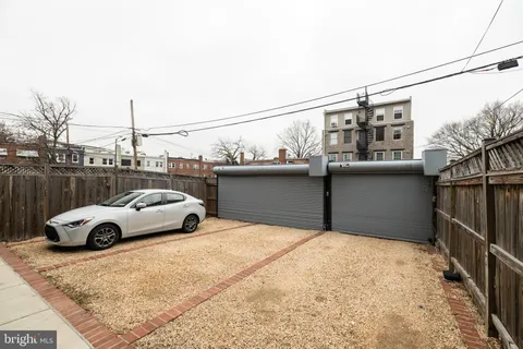 a front view of a house with parking space