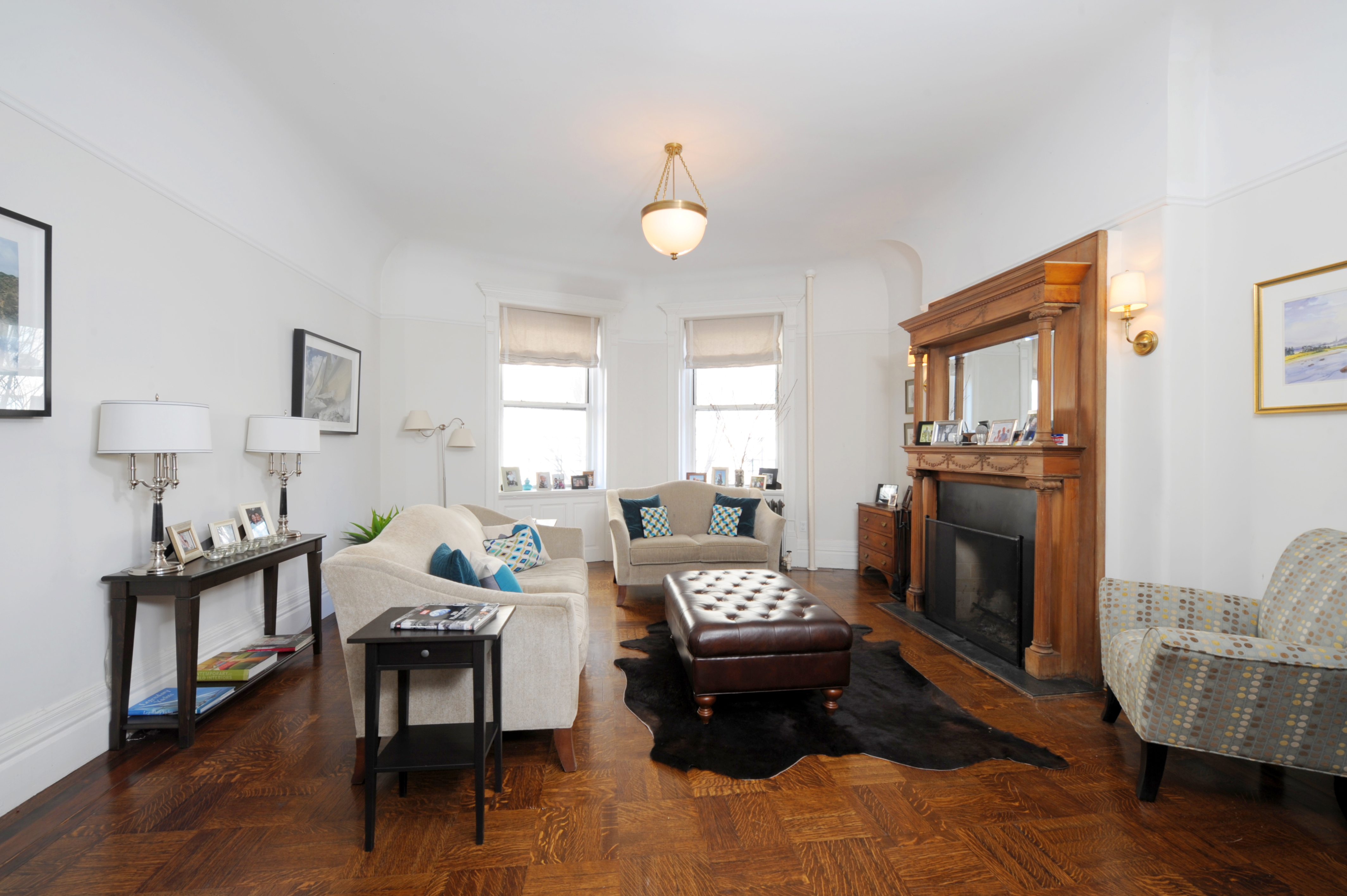 304 West 77th Street, Unit 2 Manhattan, NY 10024 - Photo 2 of 6 a living room with furniture and a lamp