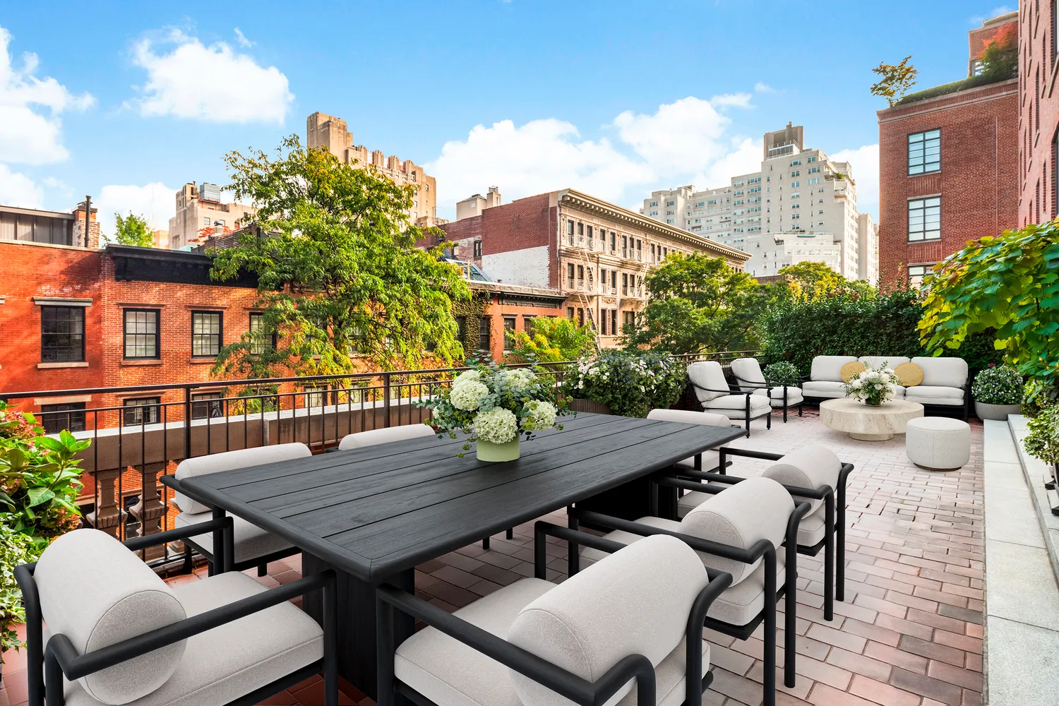 a view of a patio with table and chairs and potted plants