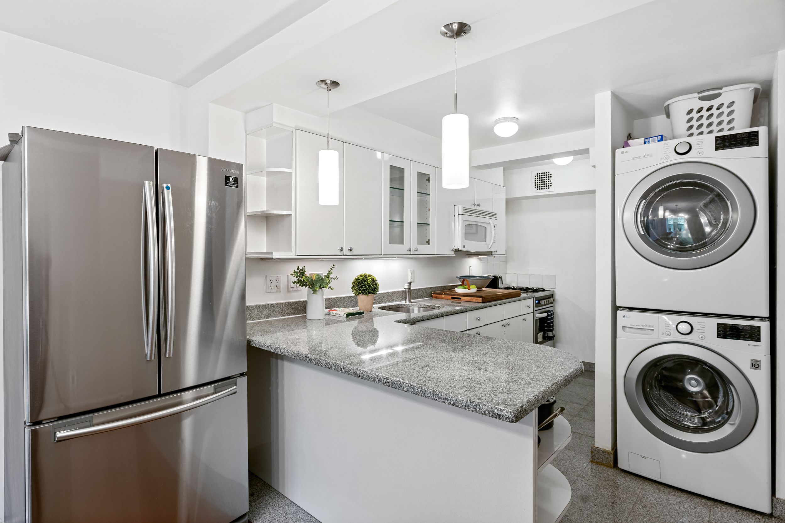 248 East 31st Street, Unit 4A Manhattan, NY 10016 - Photo 4 of 14 a kitchen with stainless steel appliances granite countertop a refrigerator and a stove
