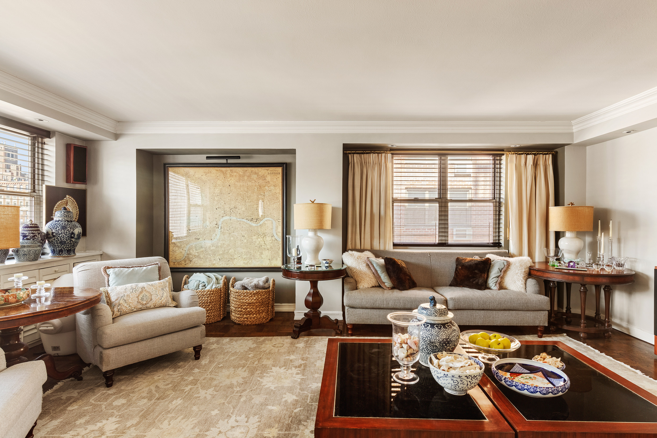 135 East 83rd Street, Unit 14D Manhattan, NY 10028 - Photo 2 of 8 a living room with furniture and a large window