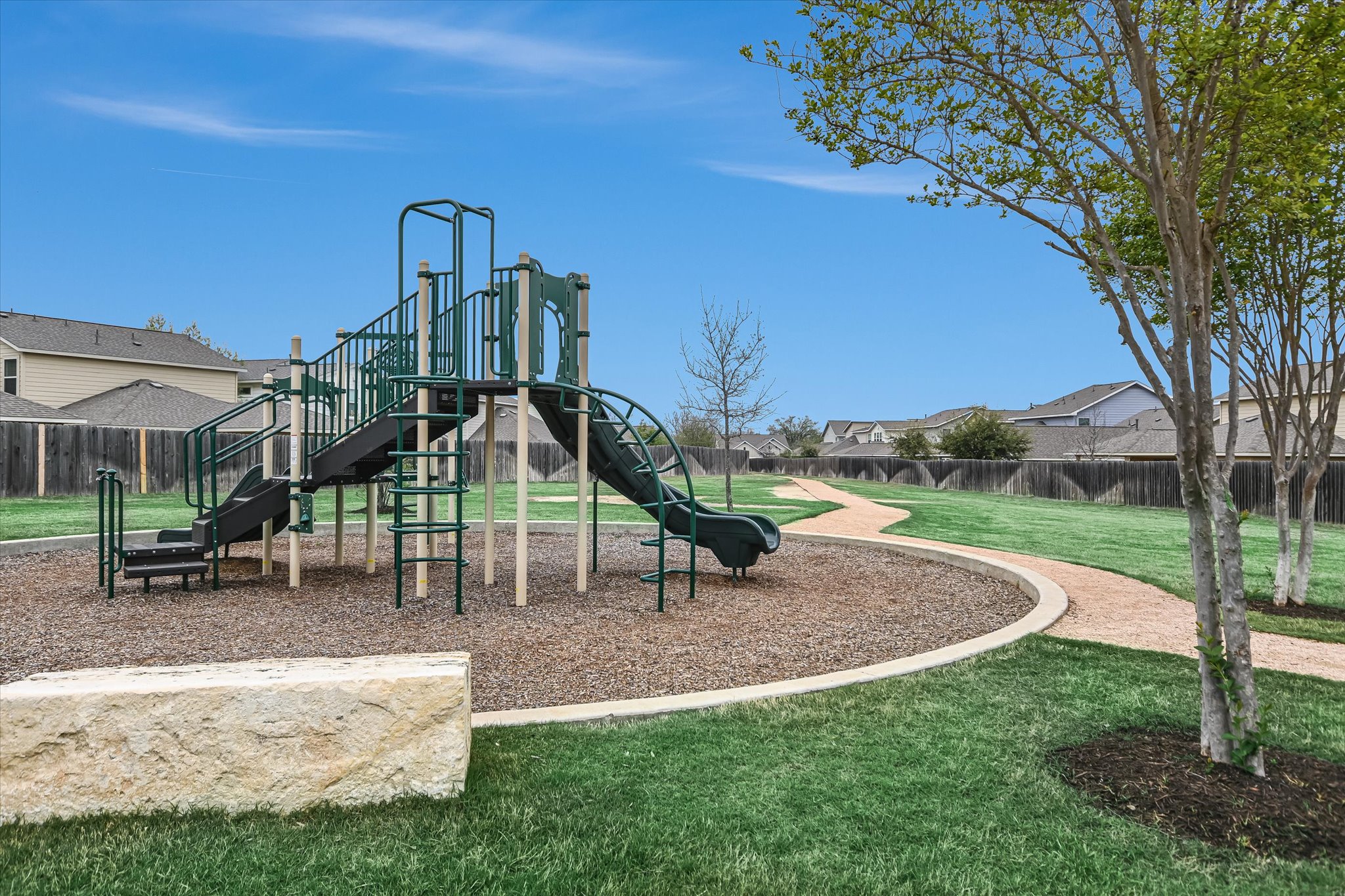 8607 McKamy Drive Austin, TX 78744 - Photo 28 of 28 a view of outdoor space with playground and green space