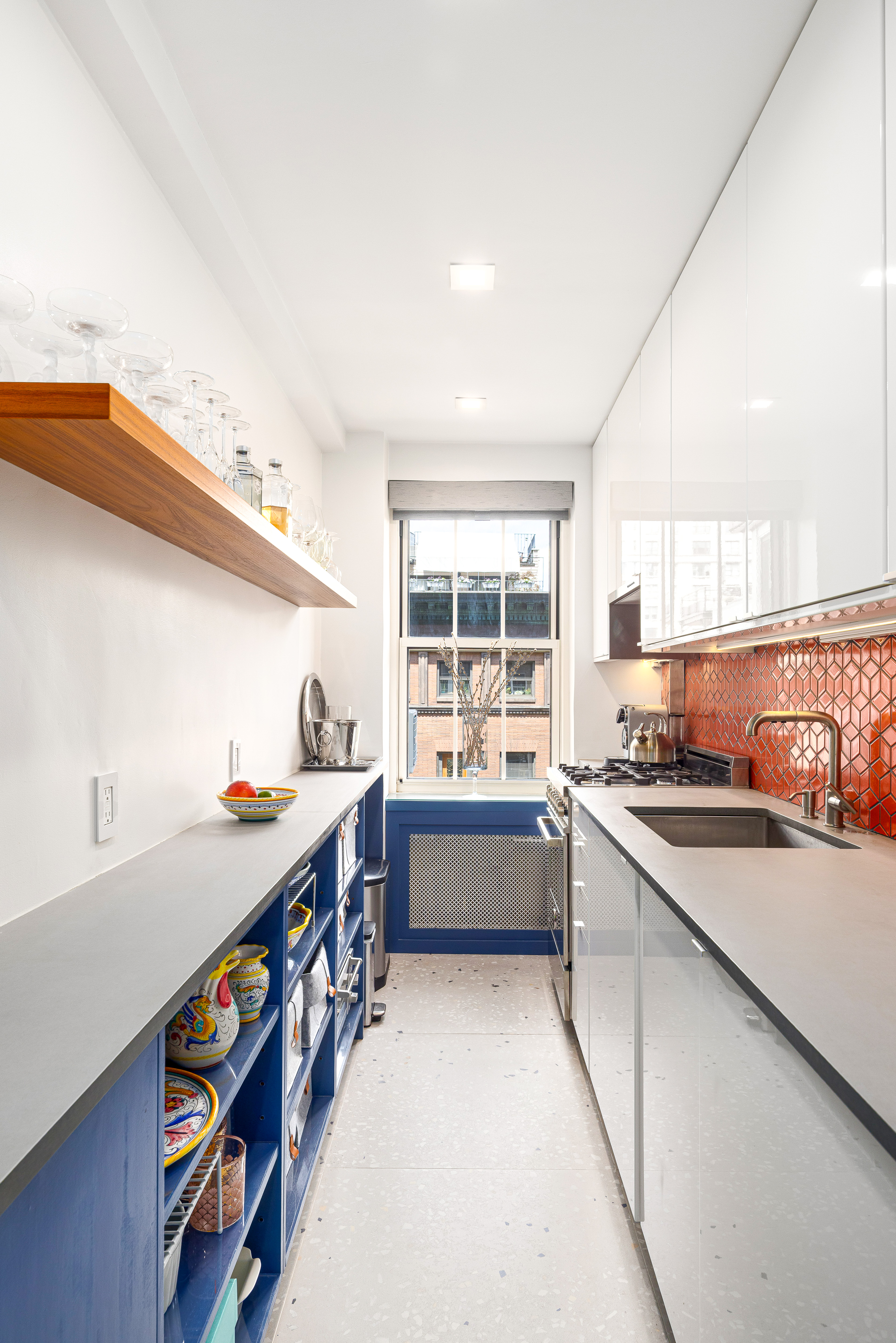 320 West 76th Street, Unit 6D Manhattan, NY 10023 - Photo 5 of 16 a kitchen with stainless steel appliances a sink and a stove