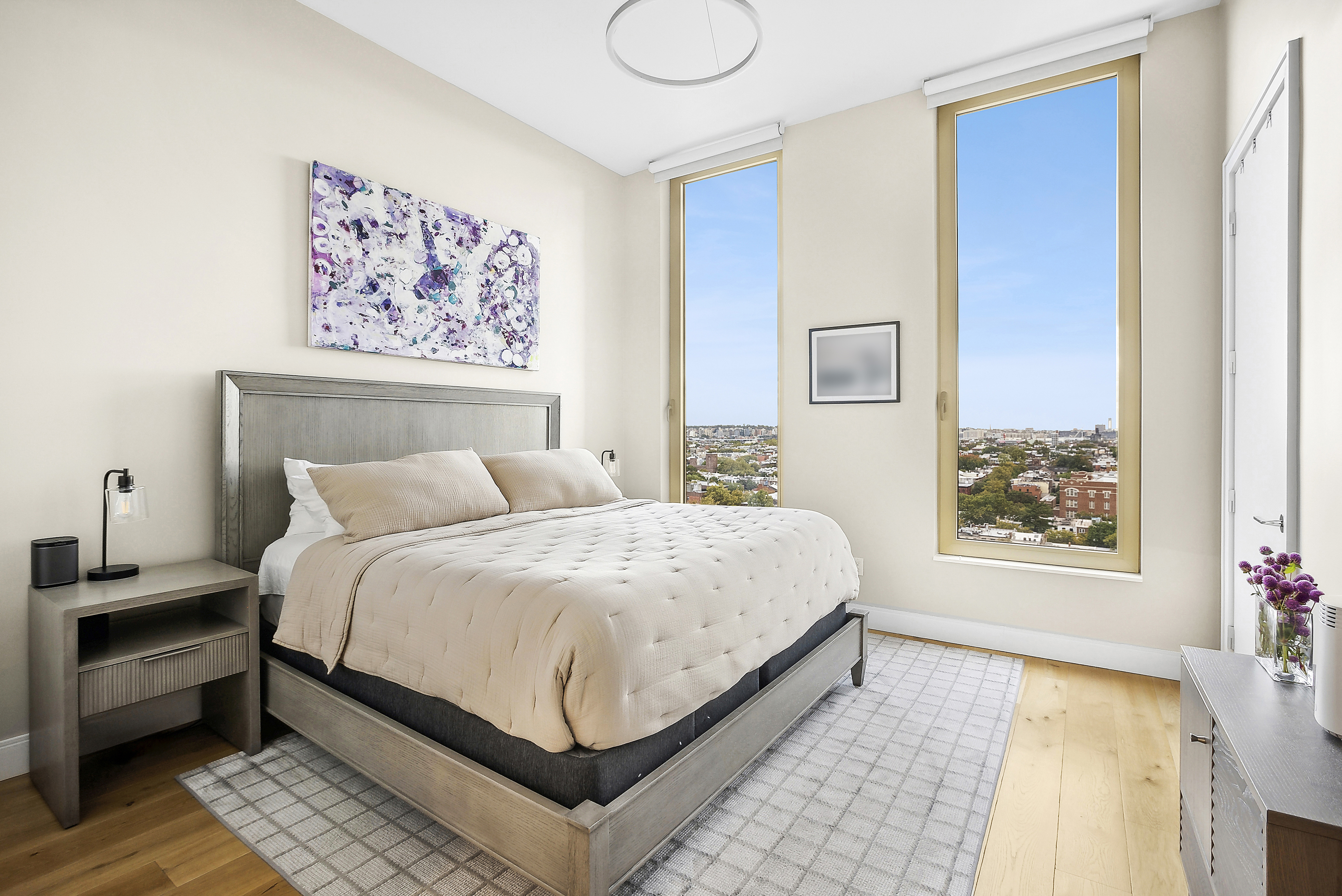 347 Henry Street, Unit 12A Brooklyn, NY 11201 - Photo 7 of 26 a bedroom with a large bed and a couch