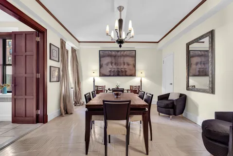 a dining room with furniture and window