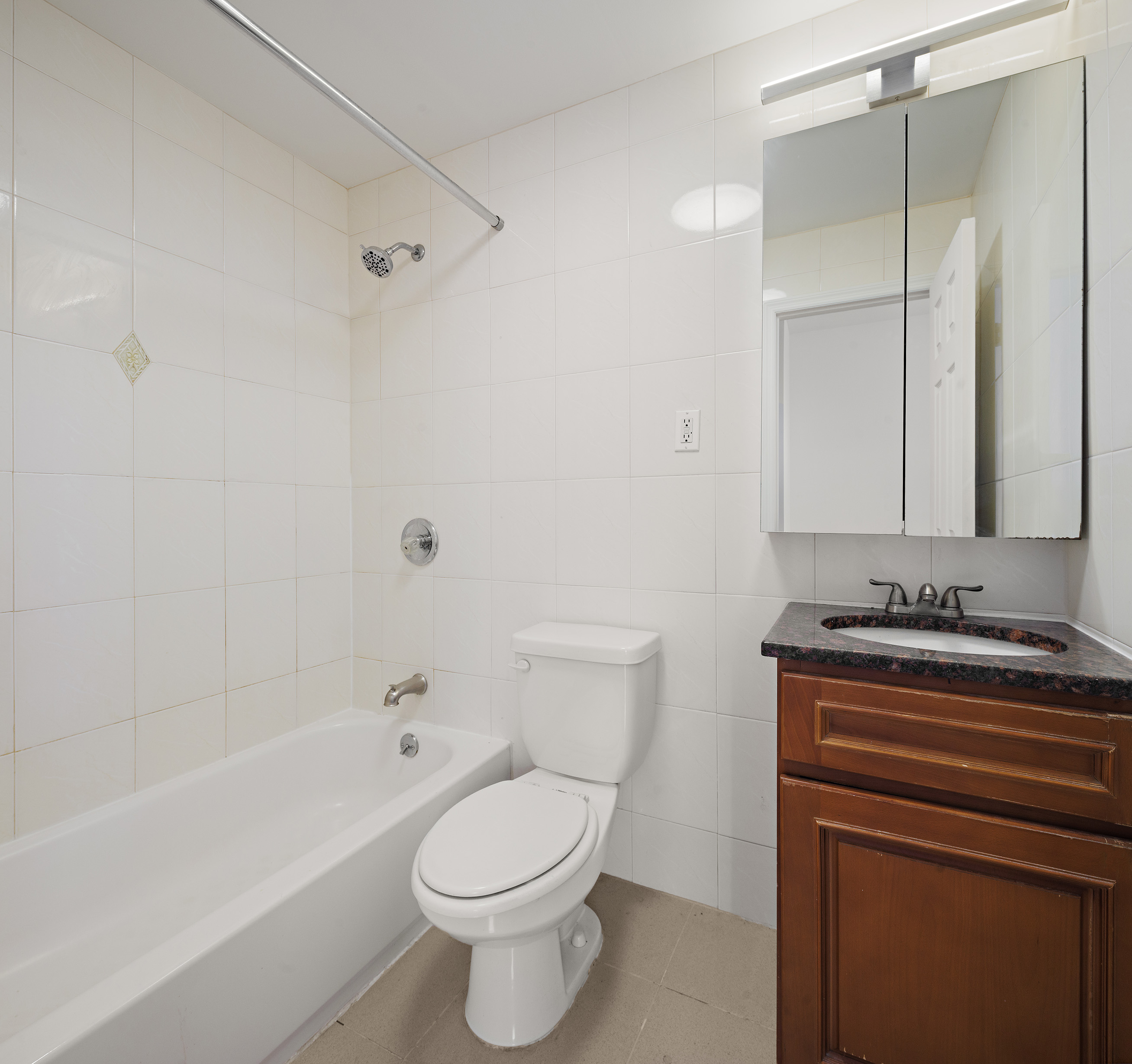 25 Bogart Street, Unit 3S Brooklyn, NY 11206 - Photo 3 of 7 a bathroom with a sink a toilet and a bathtub