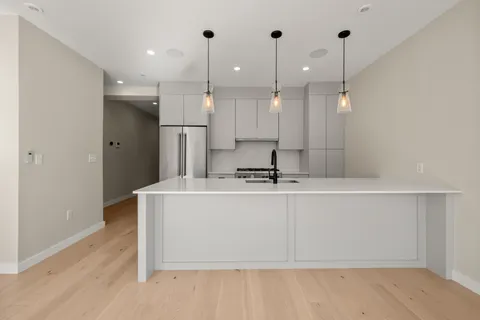 a view of a room with kitchen island
