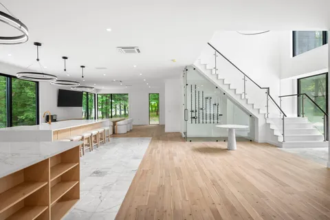a view of kitchen with furniture and a wooden floor