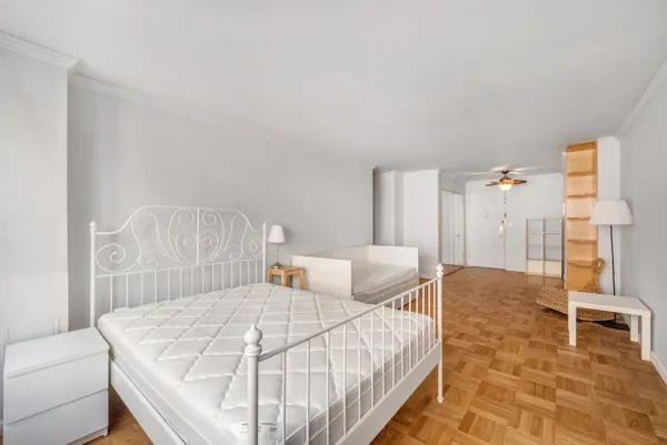 a bedroom with a bed and a table