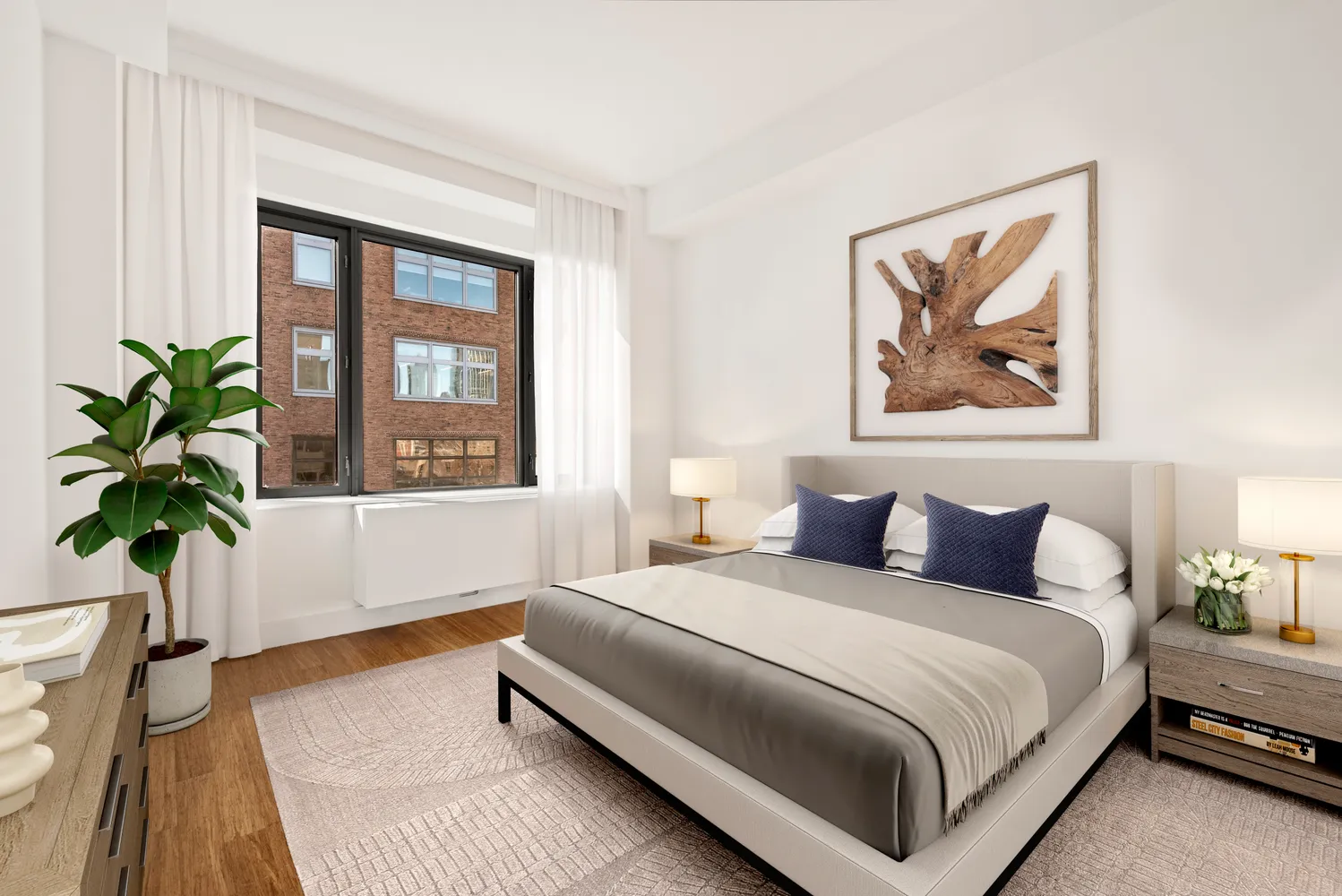 a bedroom with a bed and a potted plant