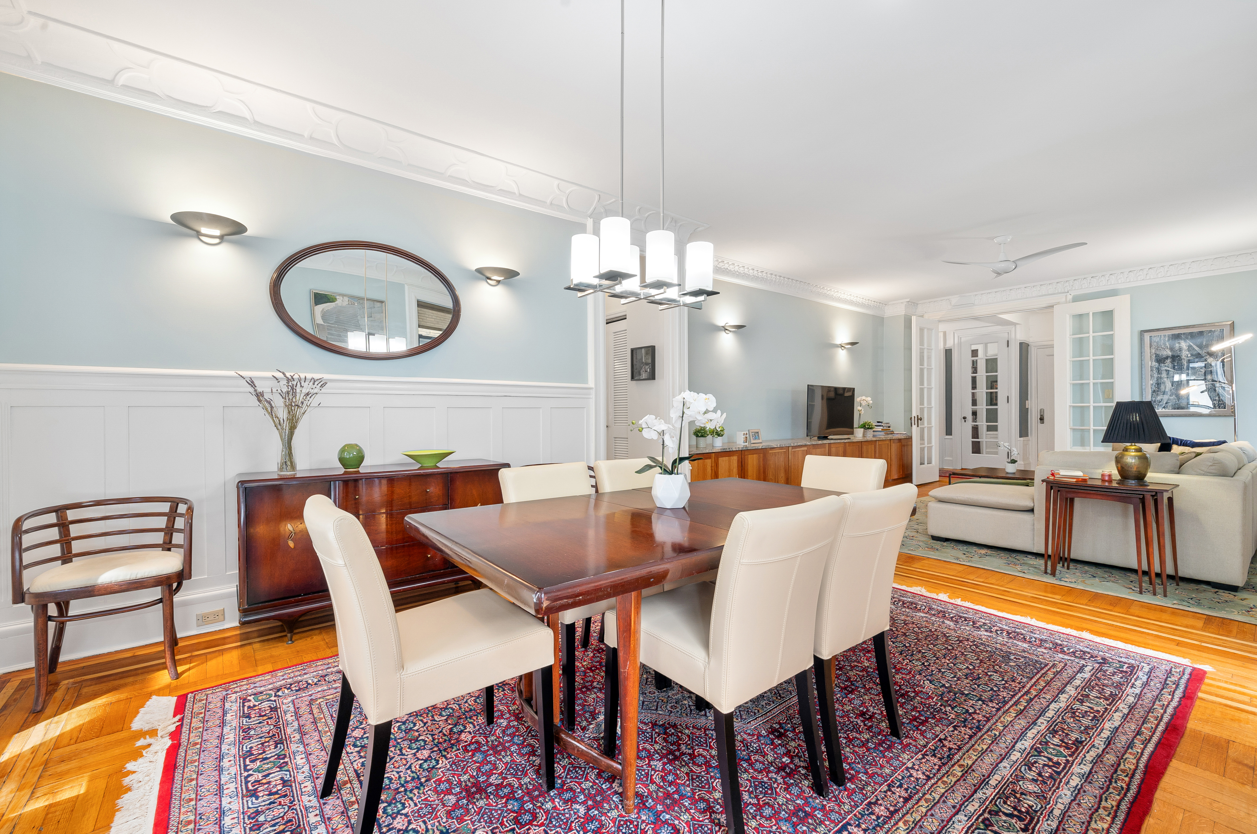 200 West 54th Street, Unit 9G Manhattan, NY 10019 - Photo 5 of 17 a view of a dining room with furniture and wooden floor