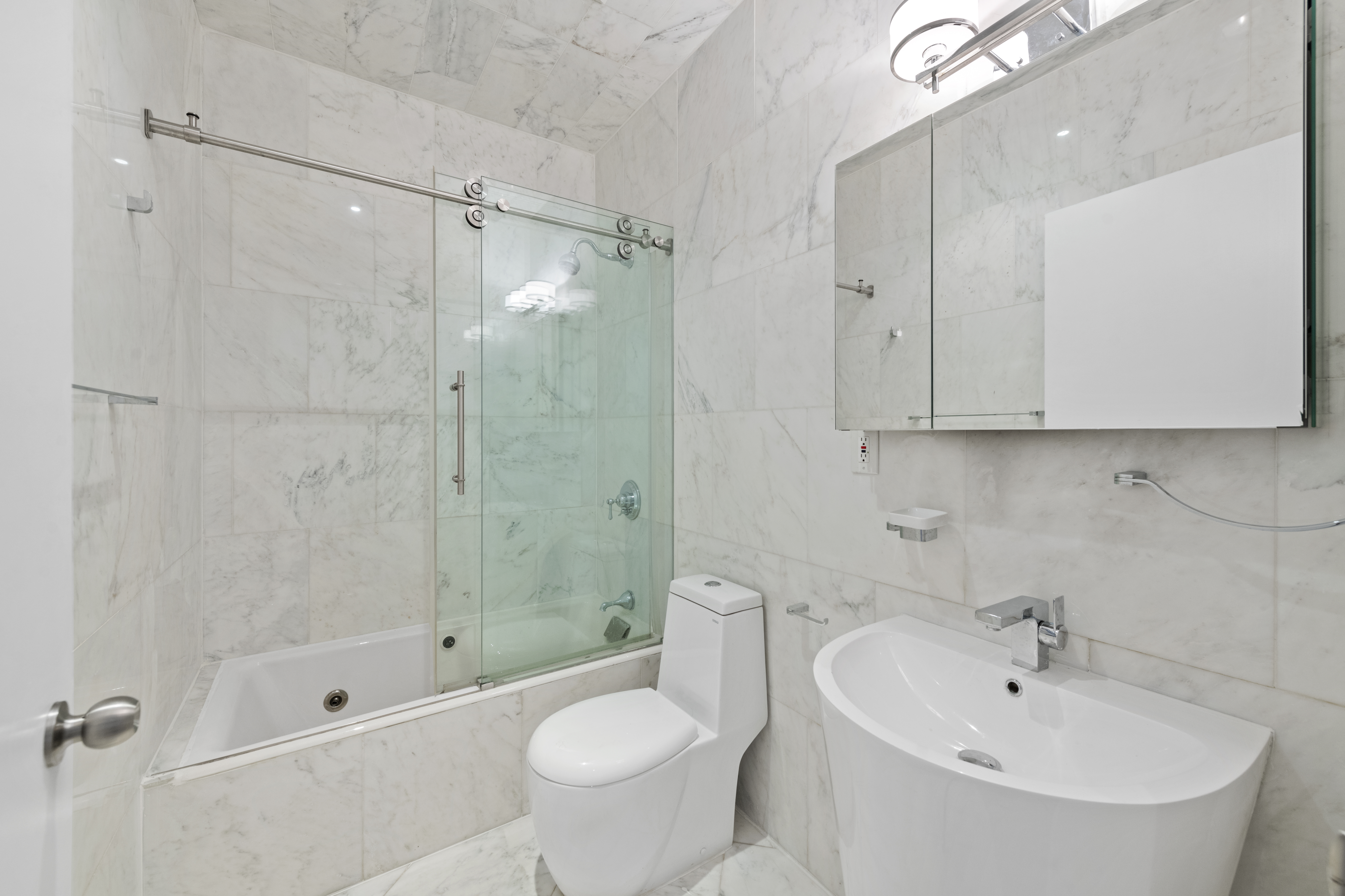 49 Walker Street, Unit PH Manhattan, NY 10013 - Photo 11 of 14 a bathroom with a toilet sink and shower