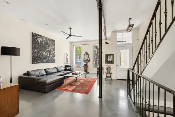 a living room with furniture and a large window