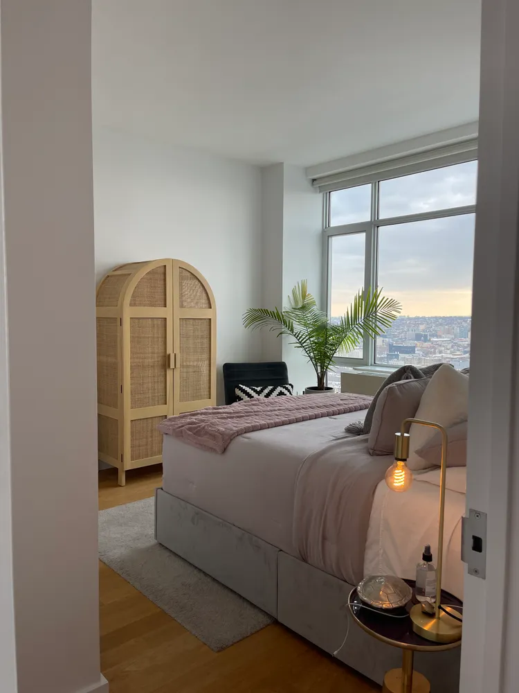 a bedroom with a bed and window