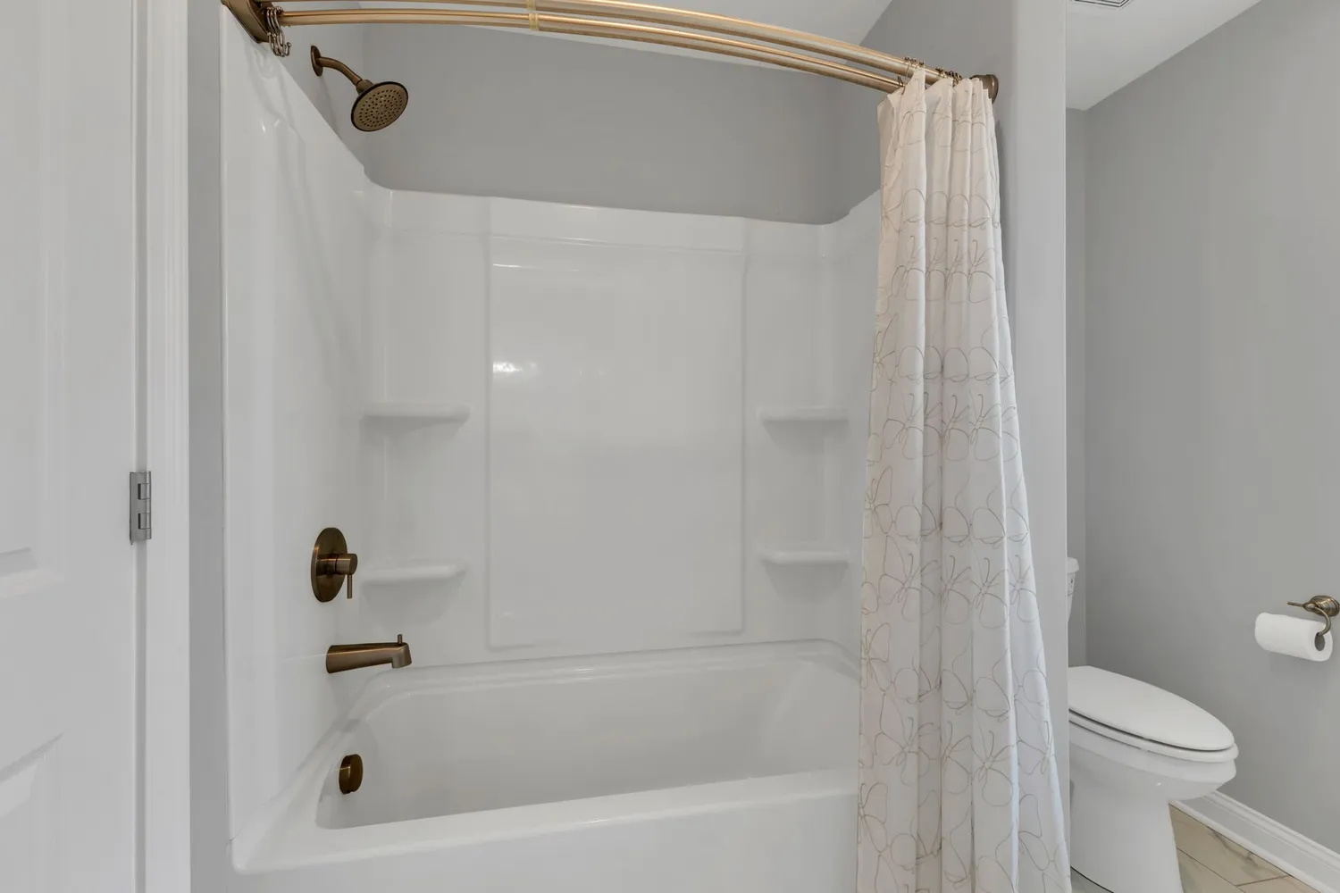 a bedroom with a large bed and a flat tv screen on a dresser