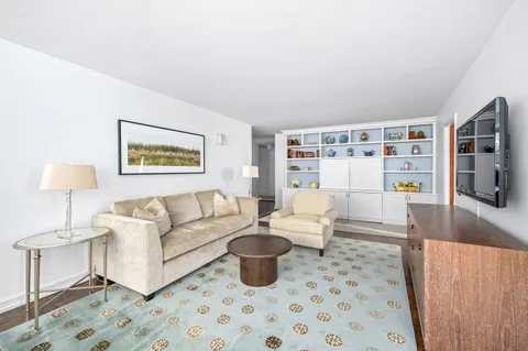 a living room with furniture and a table