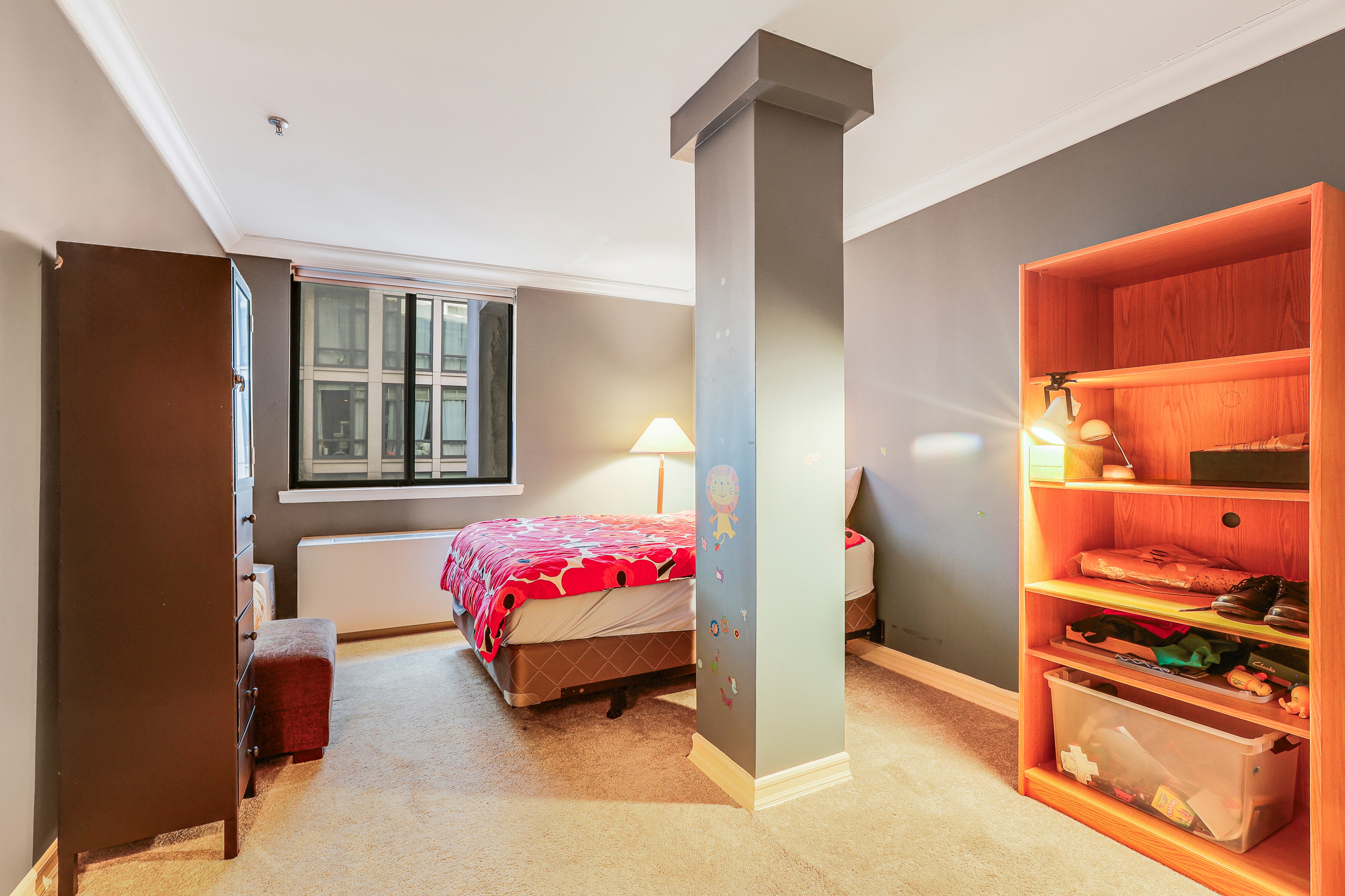 136-140 West 23rd Street, Unit 4C Manhattan, NY 10011 - Photo 8 of 12 a bedroom with a bed and a window