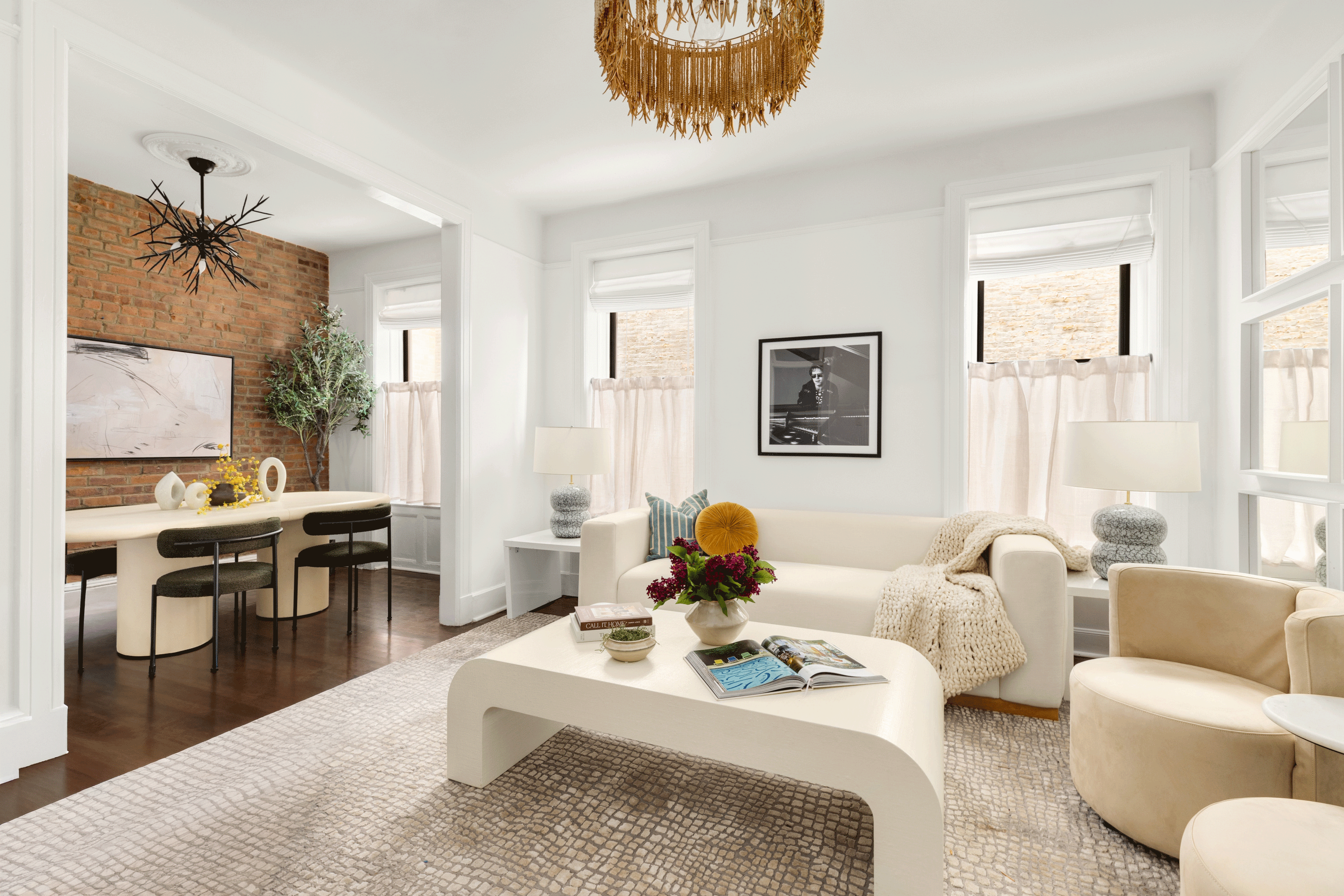 126 East 12th Street, Unit 2C Manhattan, NY 10003 - Photo 3 of 10 a living room with furniture a rug and a large window