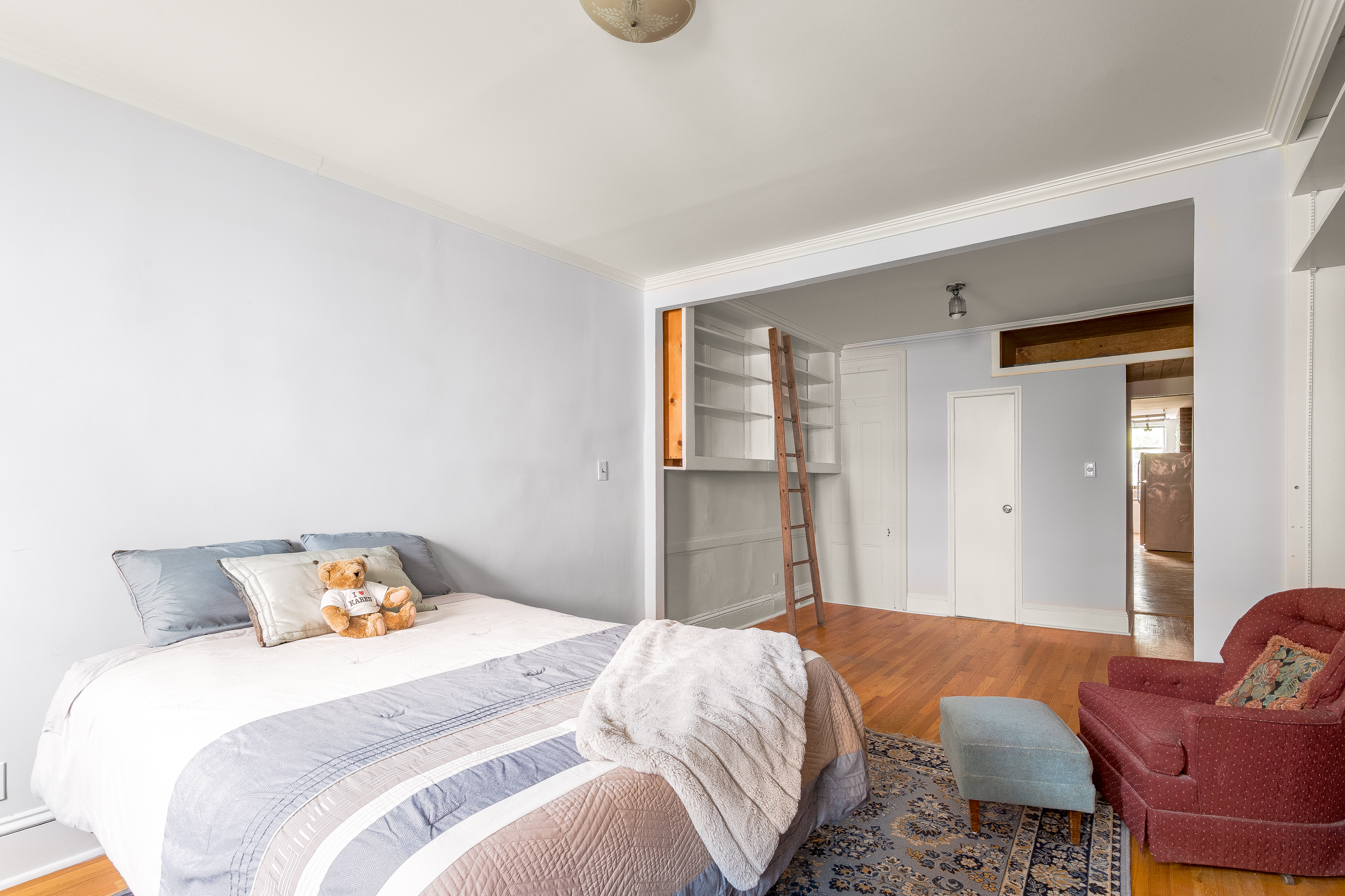 616 East 9th Street, Unit 4W Manhattan, NY 10009 - Photo 3 of 20 a bedroom with bed and a couch