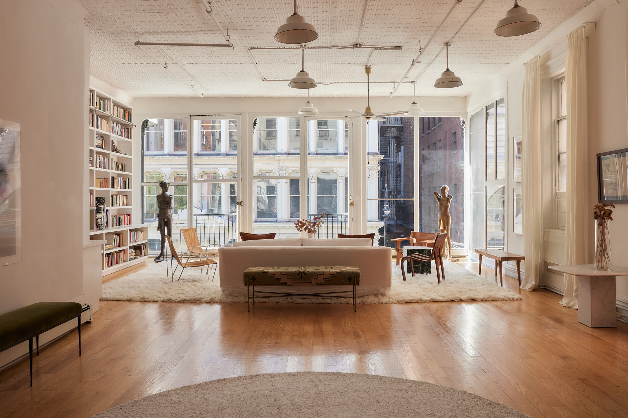 2 Bond Street, Unit 2 Manhattan, NY 10012 - Photo 1 of 16 a living room with furniture and a large window