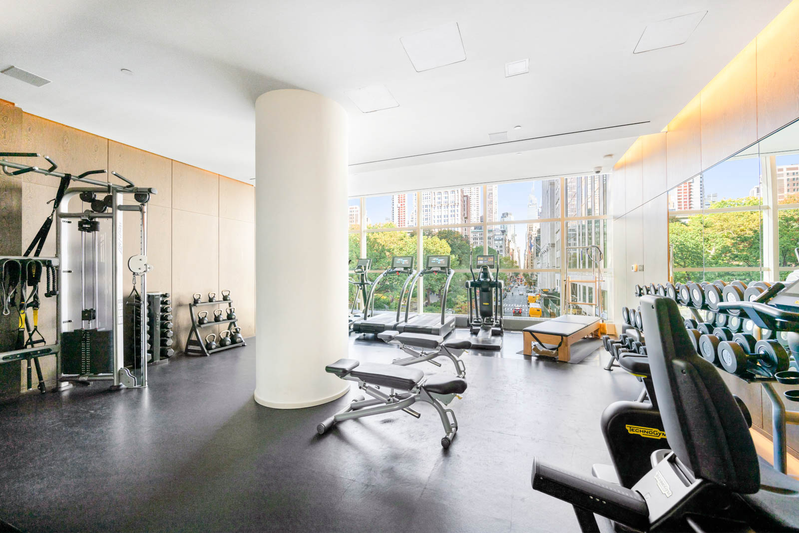23 East 22nd Street, Unit TH2 Manhattan, NY 10010 - Photo 19 of 26 a living room with furniture and floor to ceiling windows