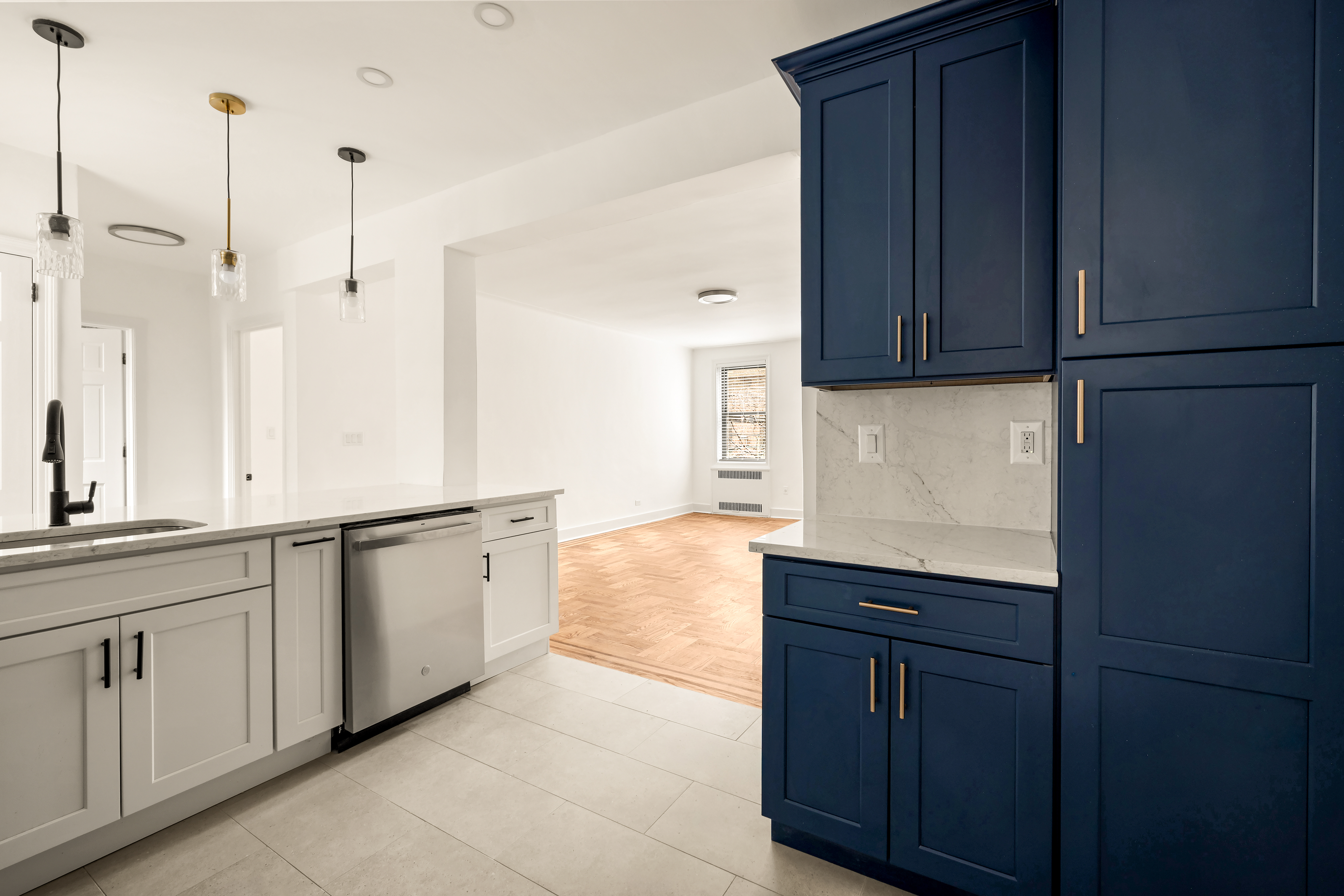 47-39 40th Street, Unit 2G Queens, NY 11104 - Photo 3 of 15 a kitchen with white cabinets and sink