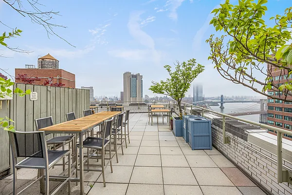 99 John Street, Unit 1101 Manhattan, NY 10038 - Photo 12 of 16 a view of a terrace with furniture and stove