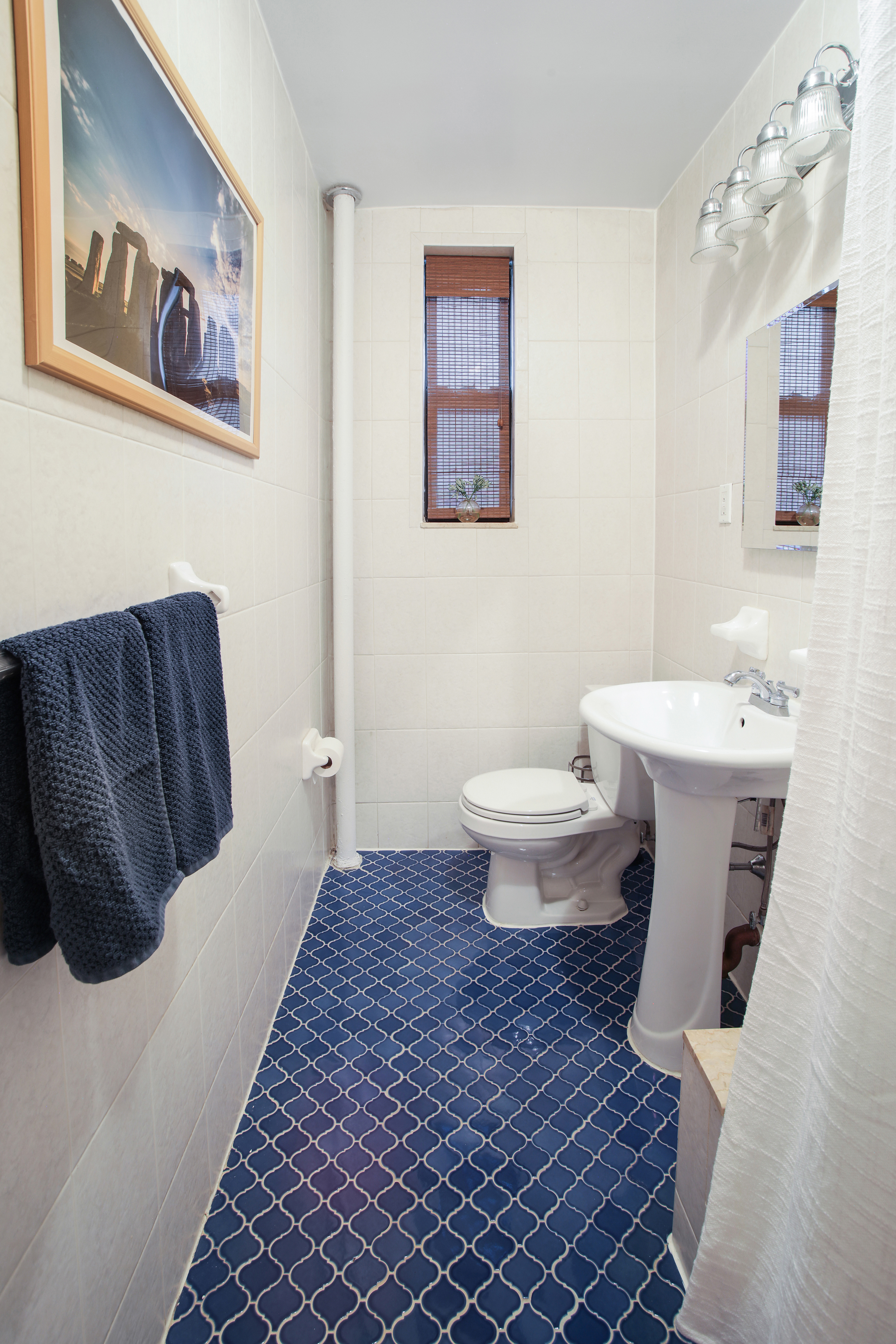 657 East 26th Street, Unit 3G Brooklyn, NY 11210 - Photo 8 of 14 a bathroom with a toilet sink and mirror