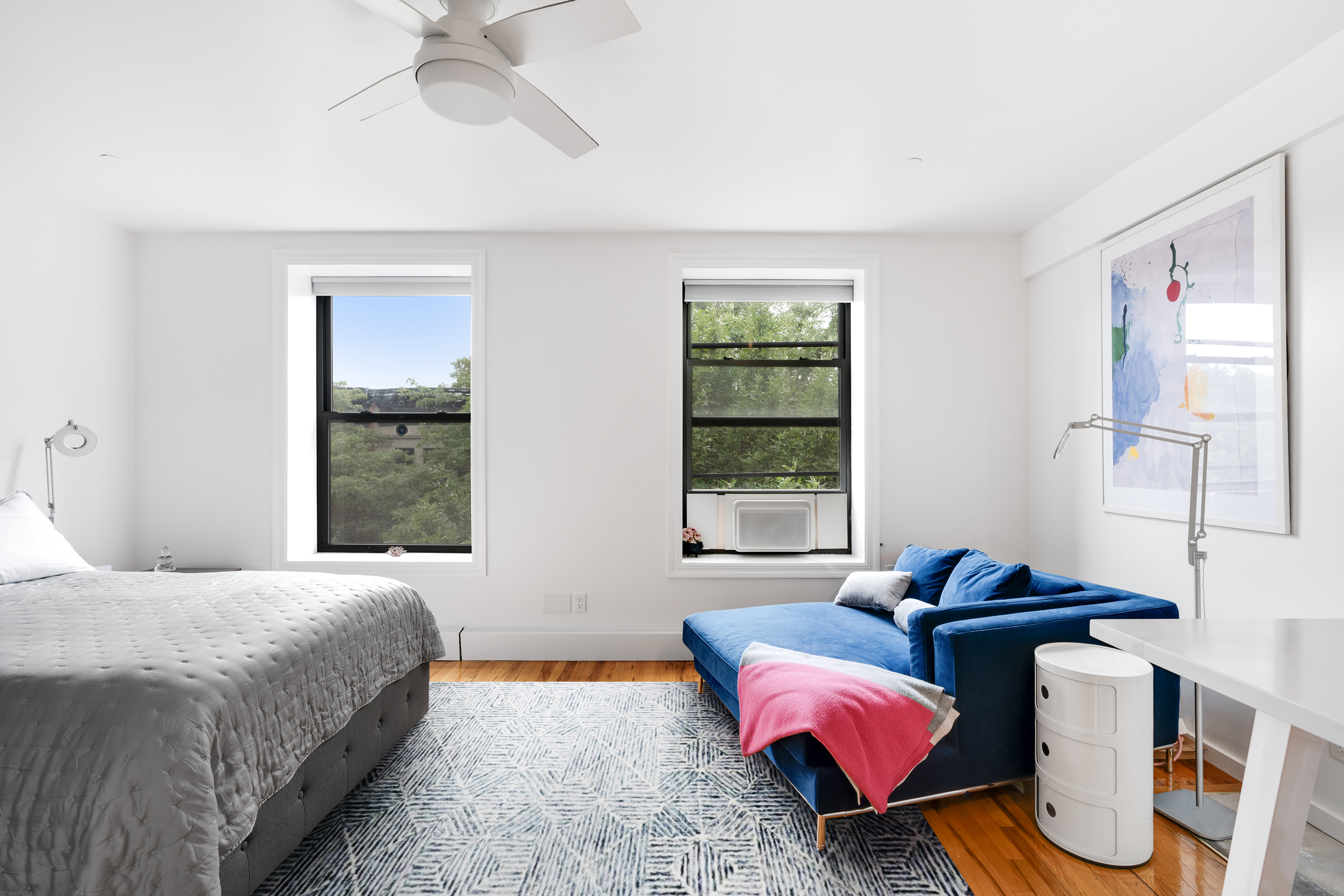 a bedroom with a bed and window