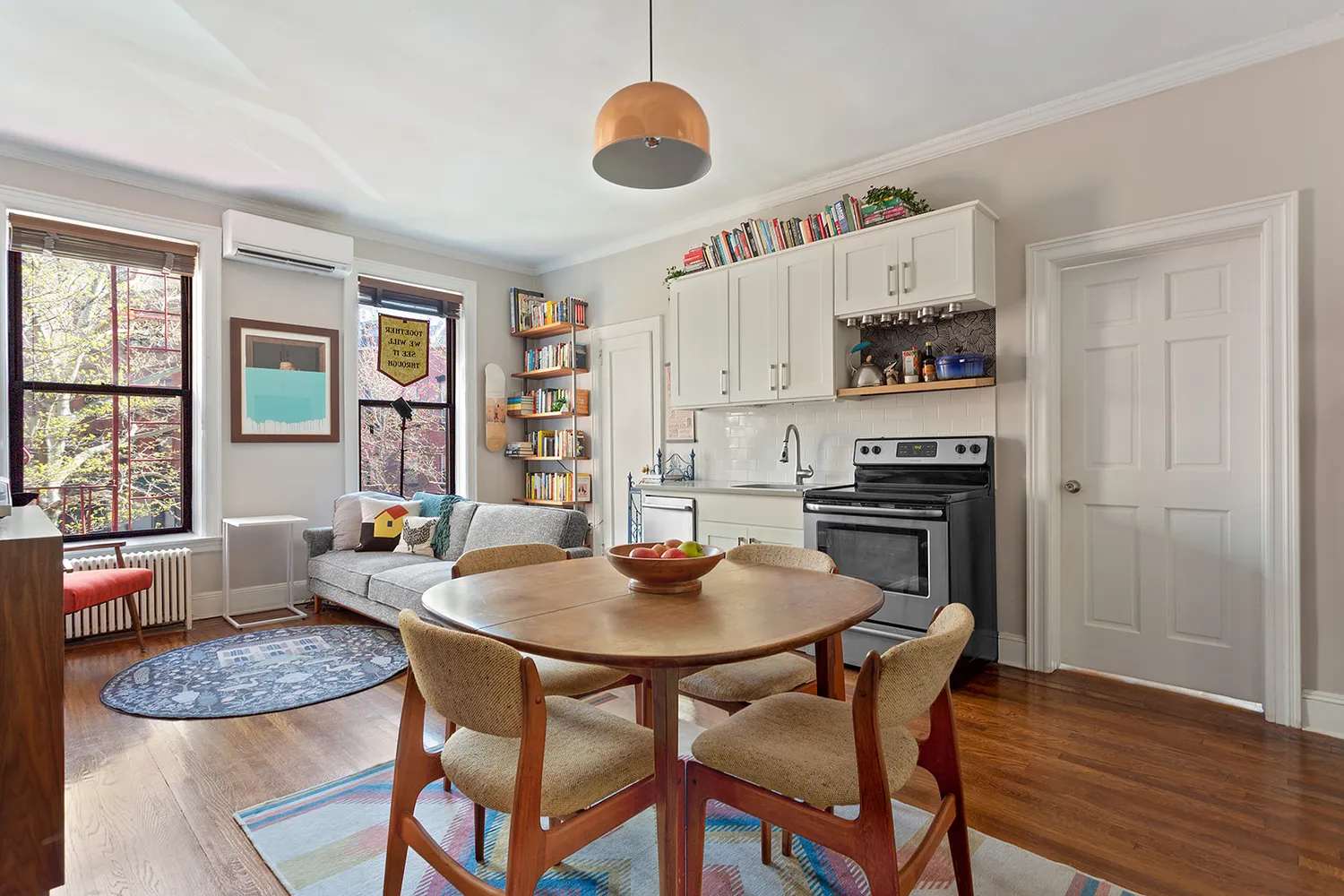 a dining room with furniture and window