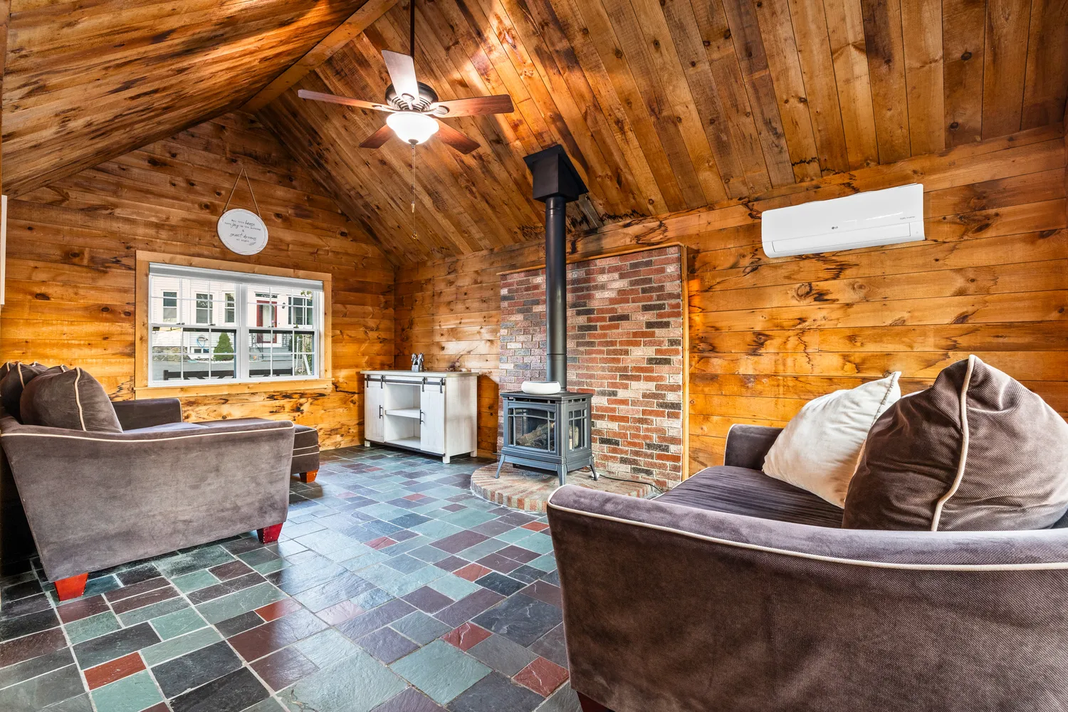 a living room with furniture and a rug