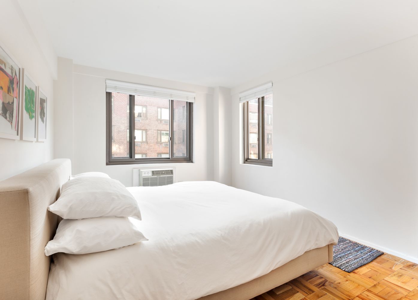 420 East 64th Street, Unit E10J Manhattan, NY 10065 - Photo 4 of 6 a bedroom with a bed and window