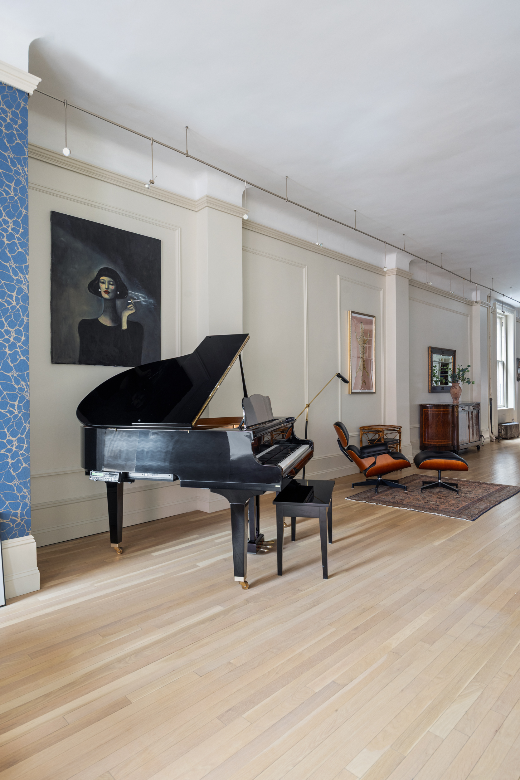 714 Broadway, Unit 8 Manhattan, NY 10003 - Photo 12 of 23 a living room with furniture a flat screen tv and a table