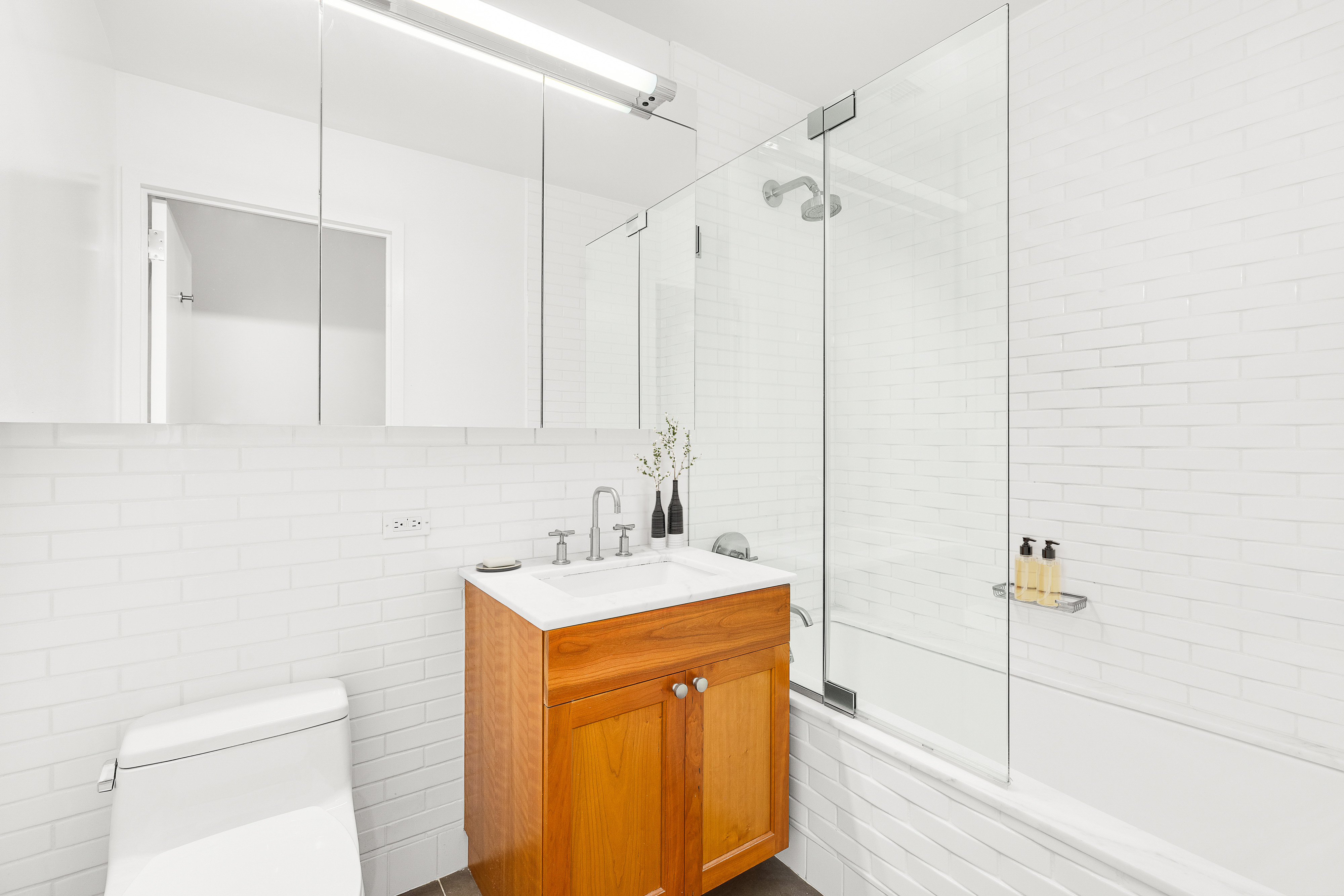9 College Place, Unit 3K Brooklyn, NY 11201 - Photo 6 of 7 a bathroom with a sink a toilet and shower