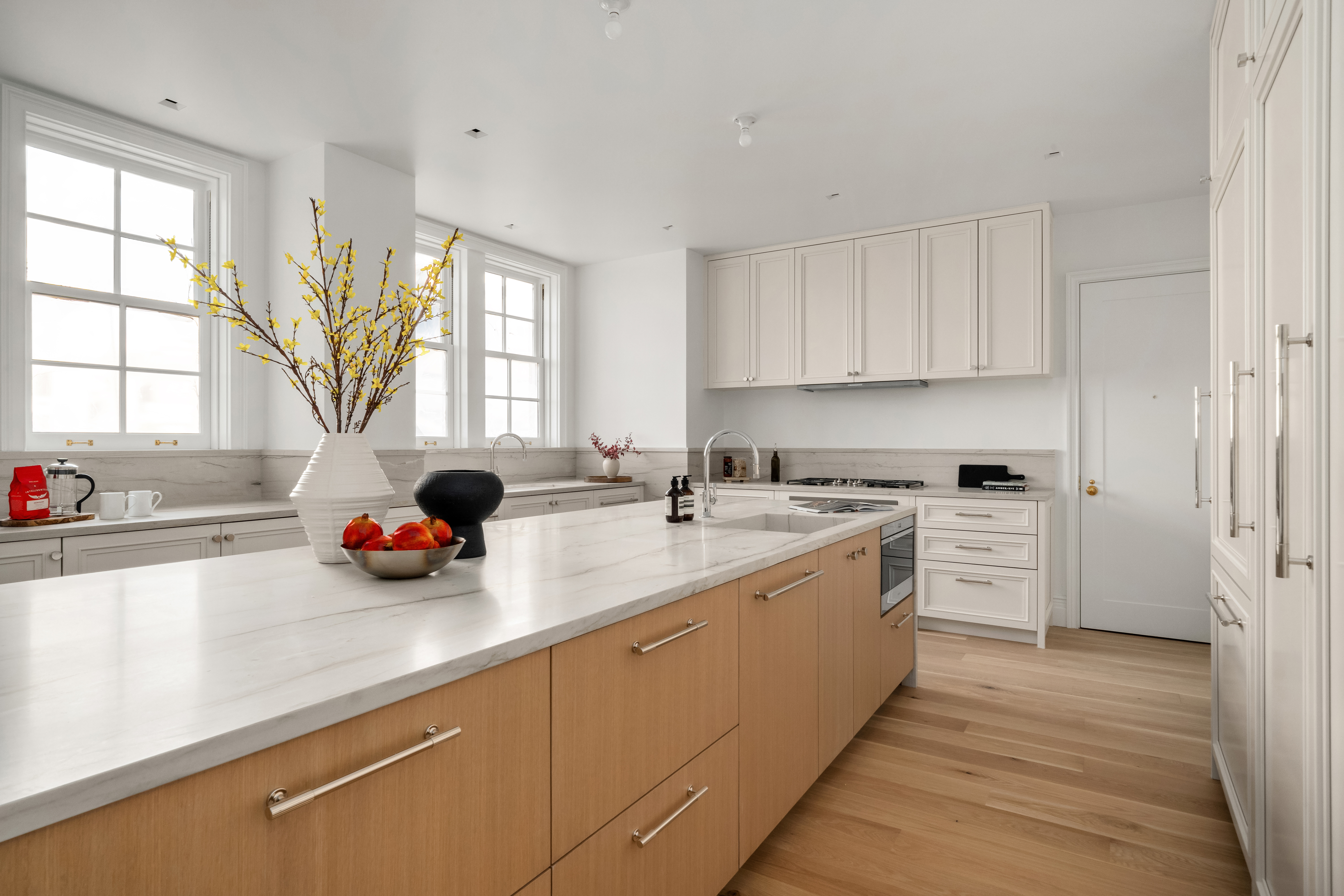 1020 5th Avenue, Unit 9 Manhattan, NY 10028 - Photo 12 of 27 a view of a kitchen with a sink a window and stainless steel appliances