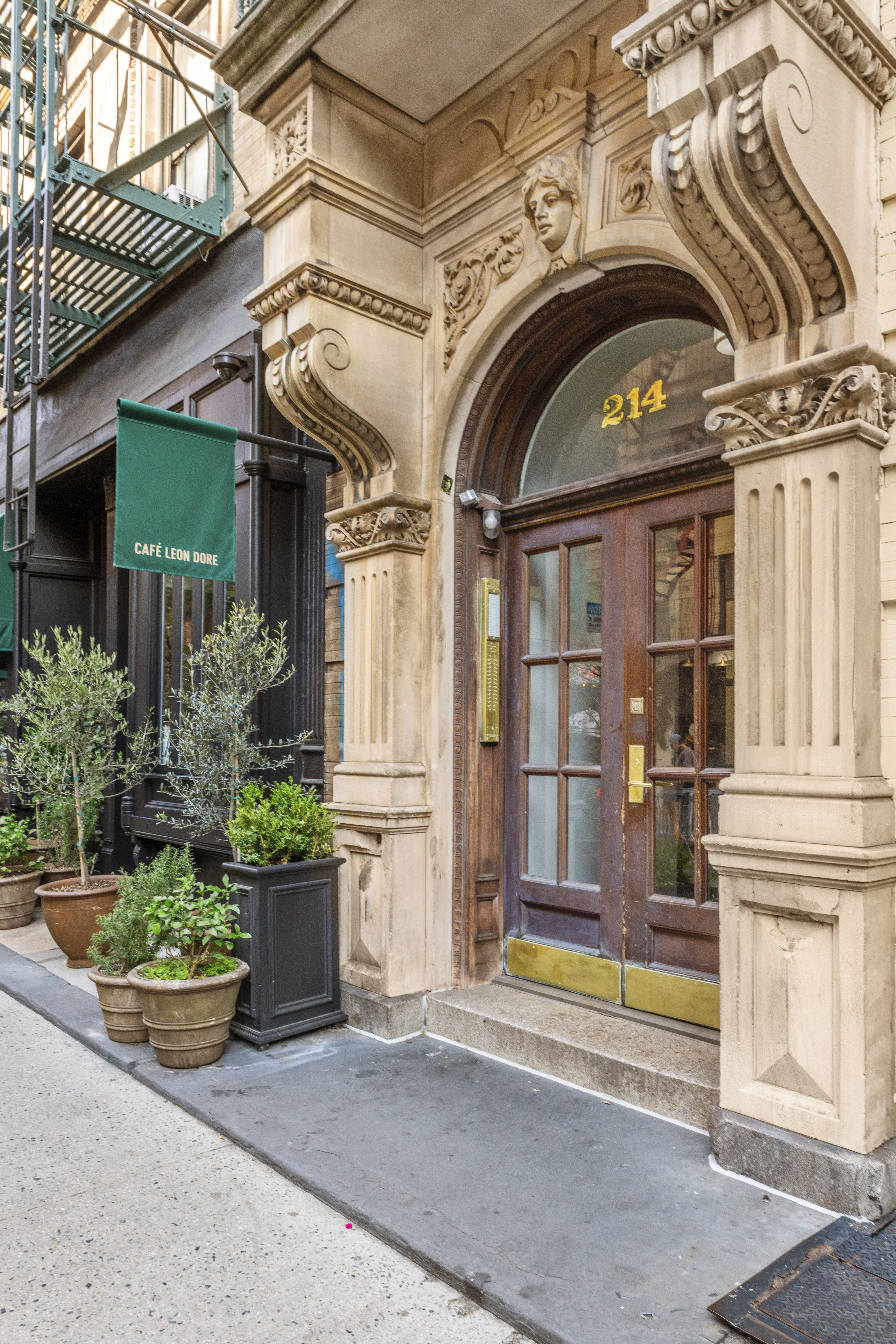 214 Mulberry Street, Unit 6B Manhattan, NY 10012 - Photo 10 of 12 a front view of a house with plants